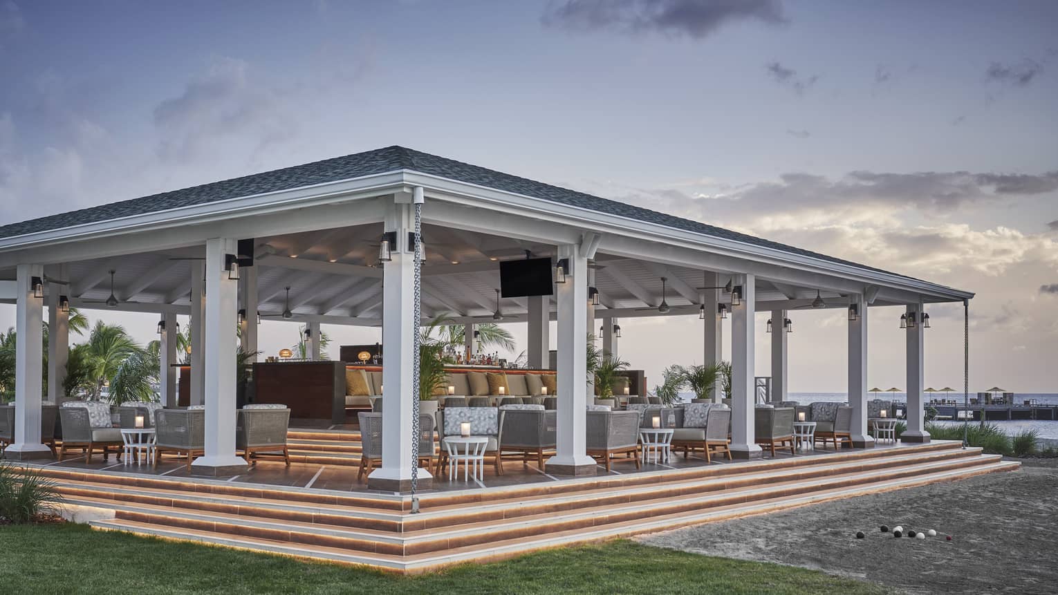 A covered outdoor eating area on a sand dune.