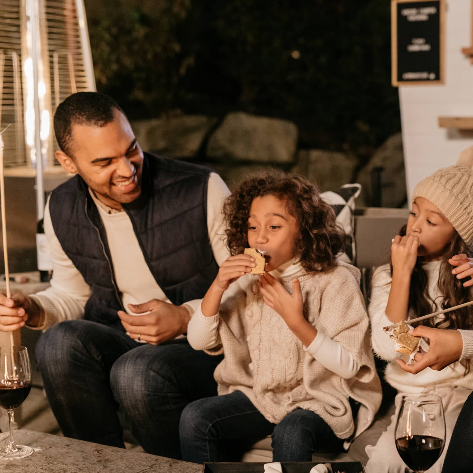 A family enjoying snacks and drinks.