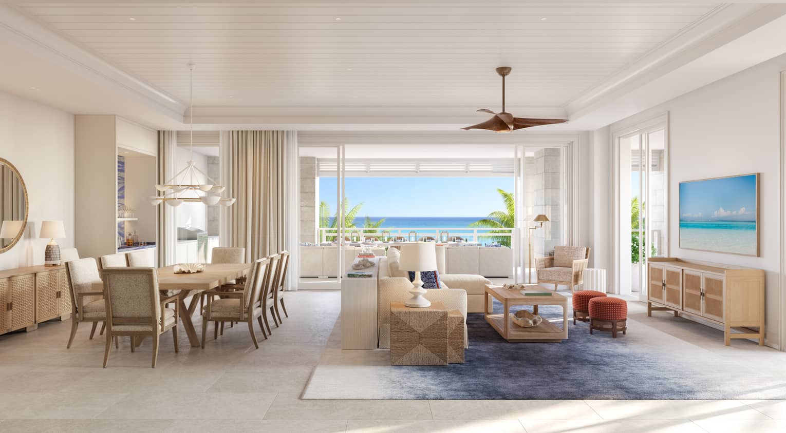 Luxury open-concept living and dining area with coastal décor, light wood furniture and floor-to-ceiling windows showcasing ocean views and a balcony