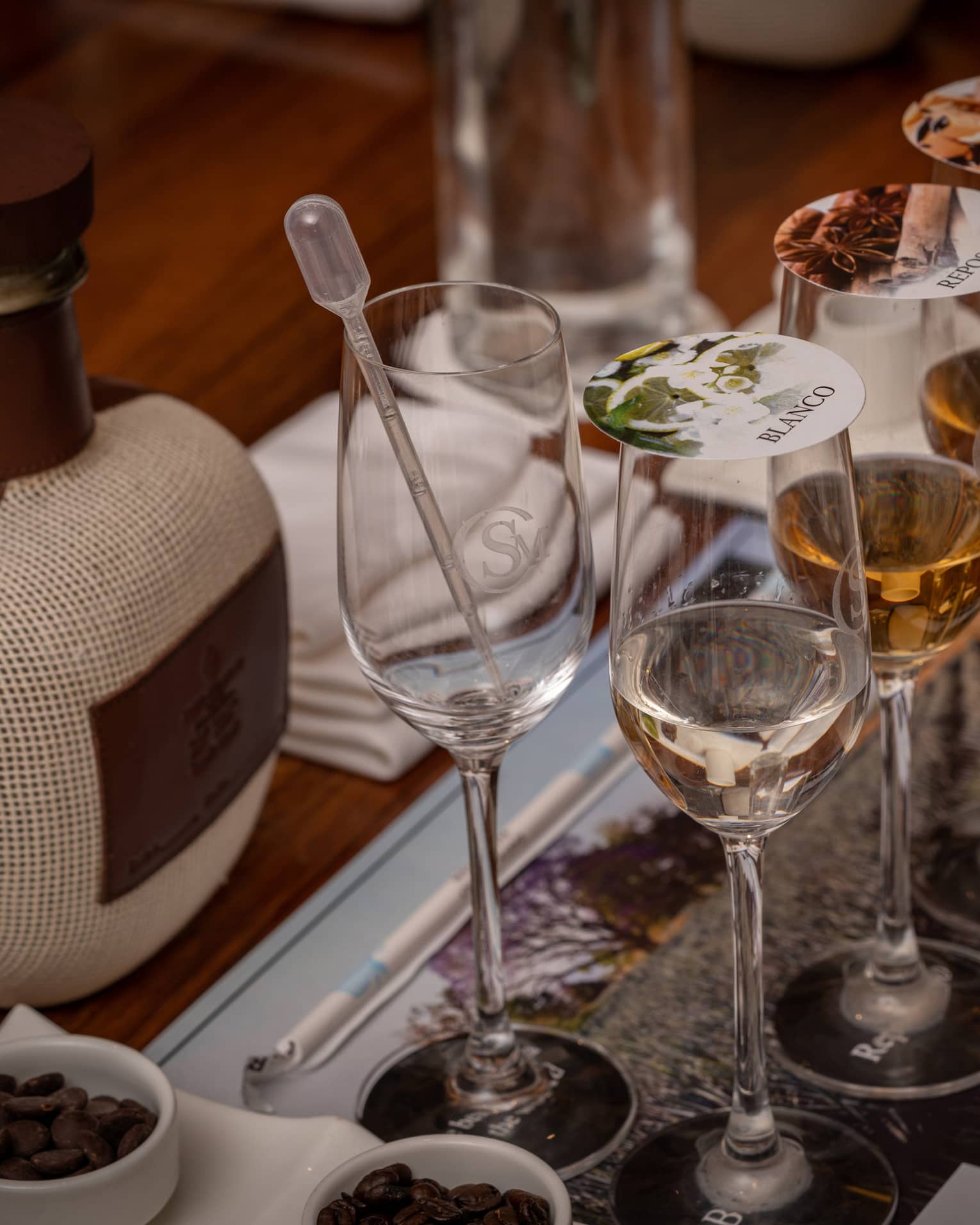 Blending tequila in glasses with covers.