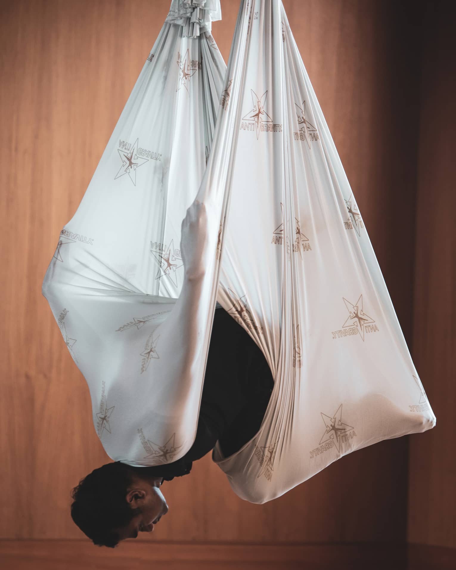 Man does aerial yoga