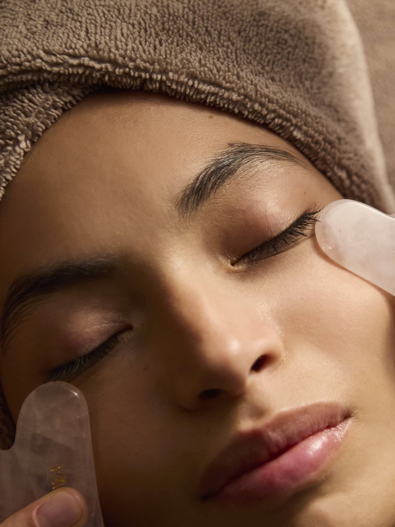 A person receives a facial treatment.