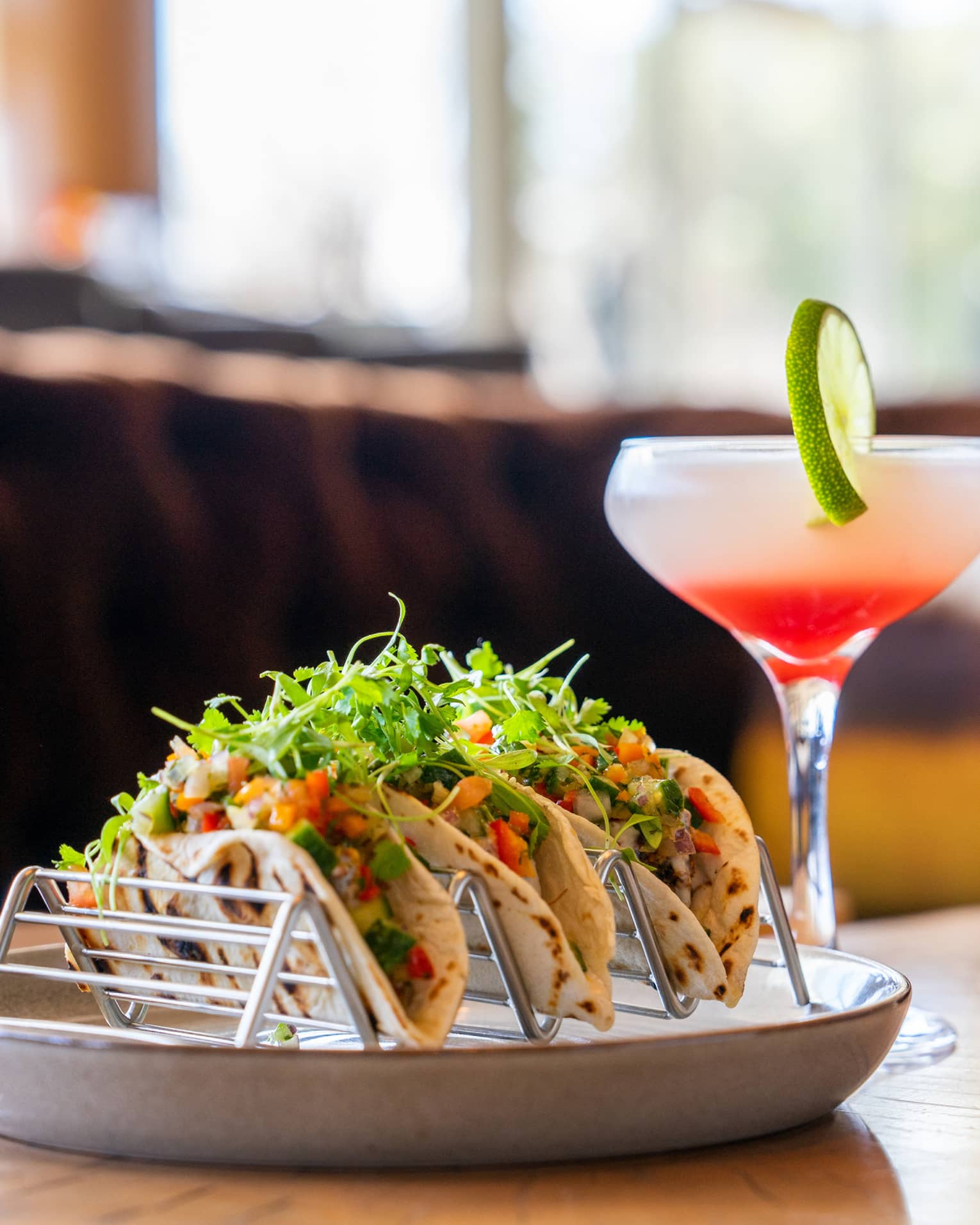 Tacos and a pink cocktail.