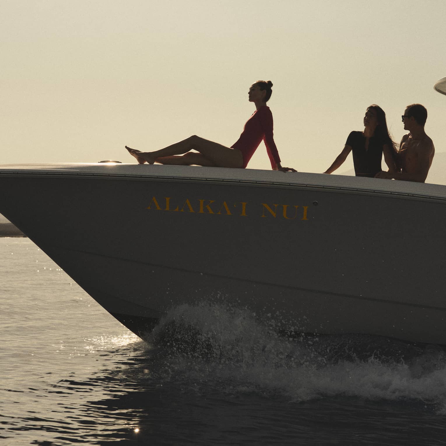 Three people on a luxury yacht at sea