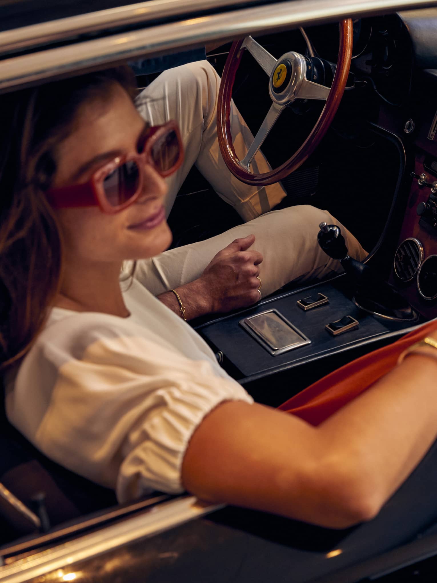Woman looks out window of car