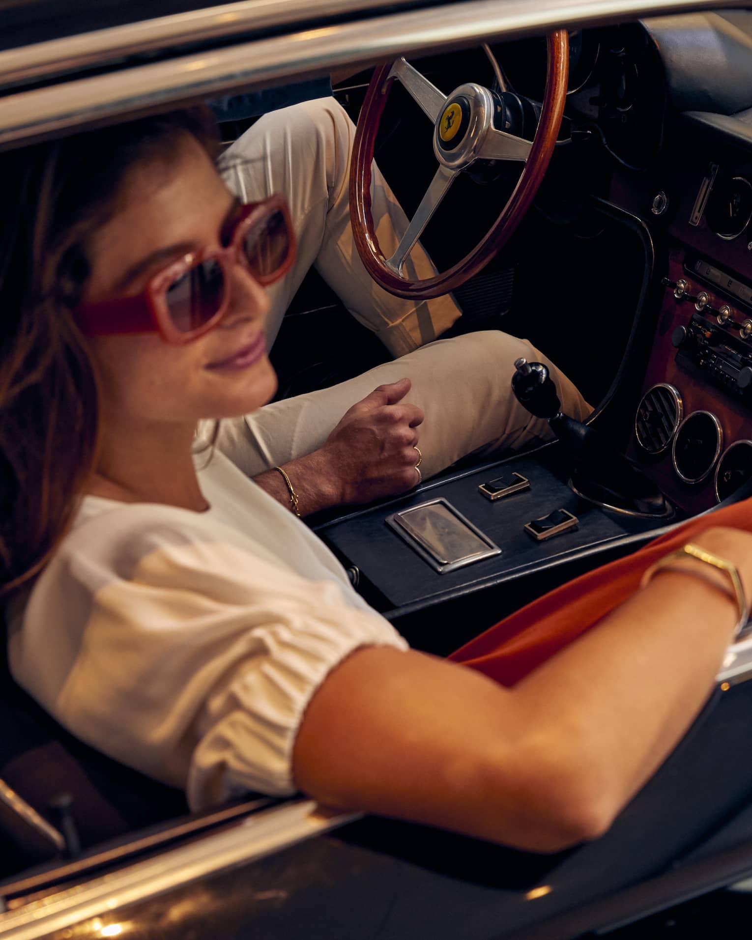 Woman looks out window of car