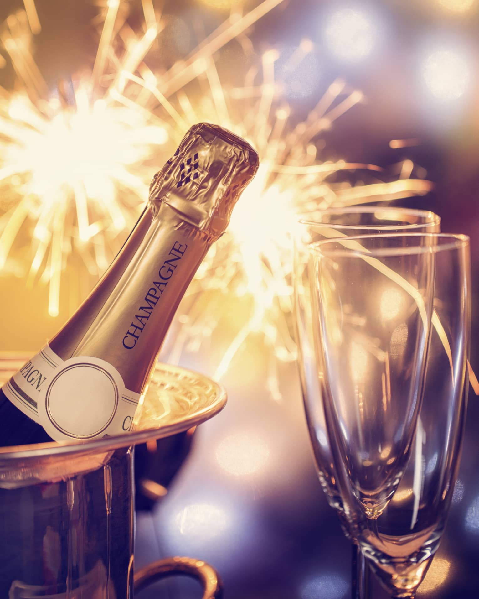Fireworks, champagne and two champagne flutes