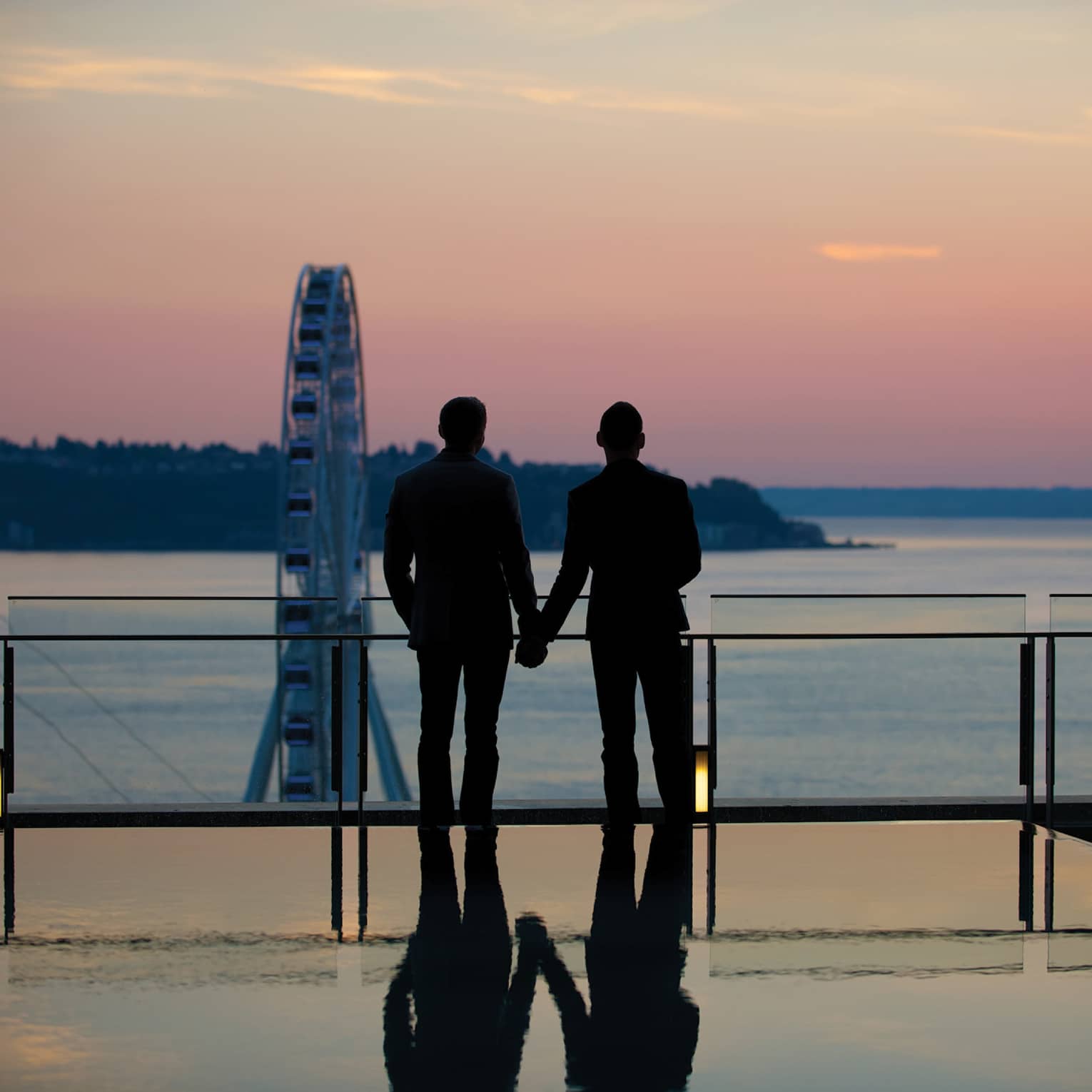 This image depicting two people holding hands and relates to ESG at Four Seasons and advancing diversity, inclusion and belonging at Four Seasons.