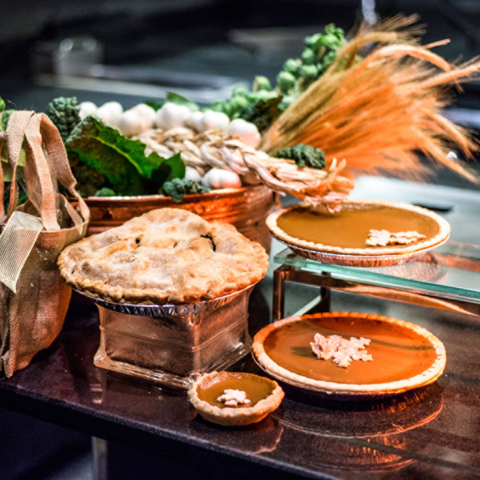 An assortment of Thanksgiving pies, including pumpkin and apple.