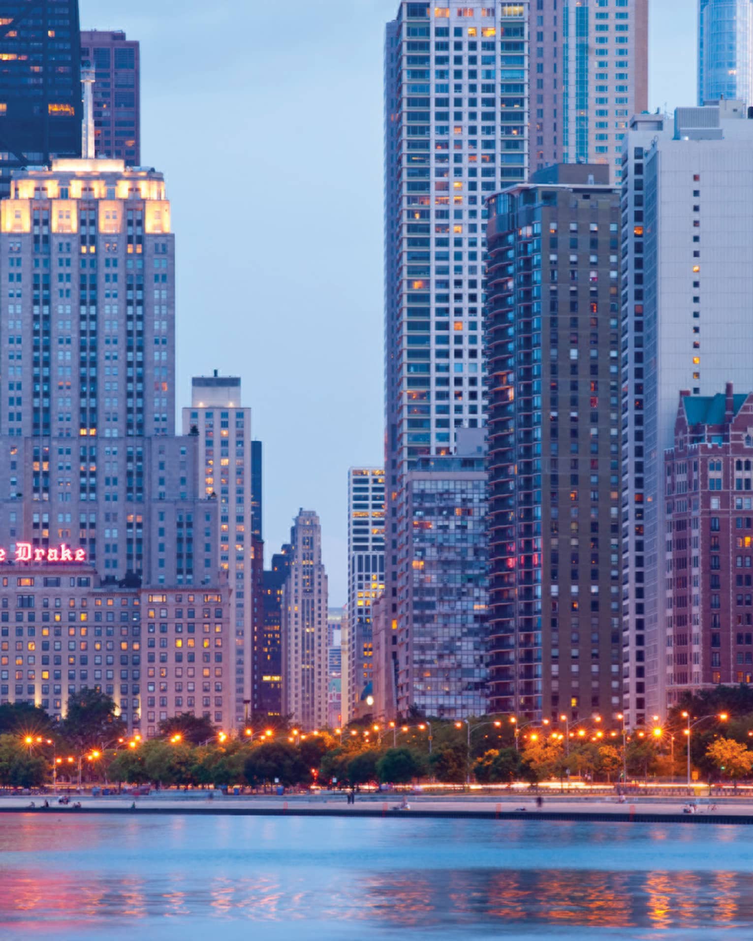 A view of a modern city at dusk.