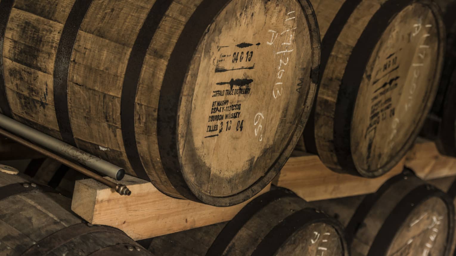 Rows of stacked rum barrels