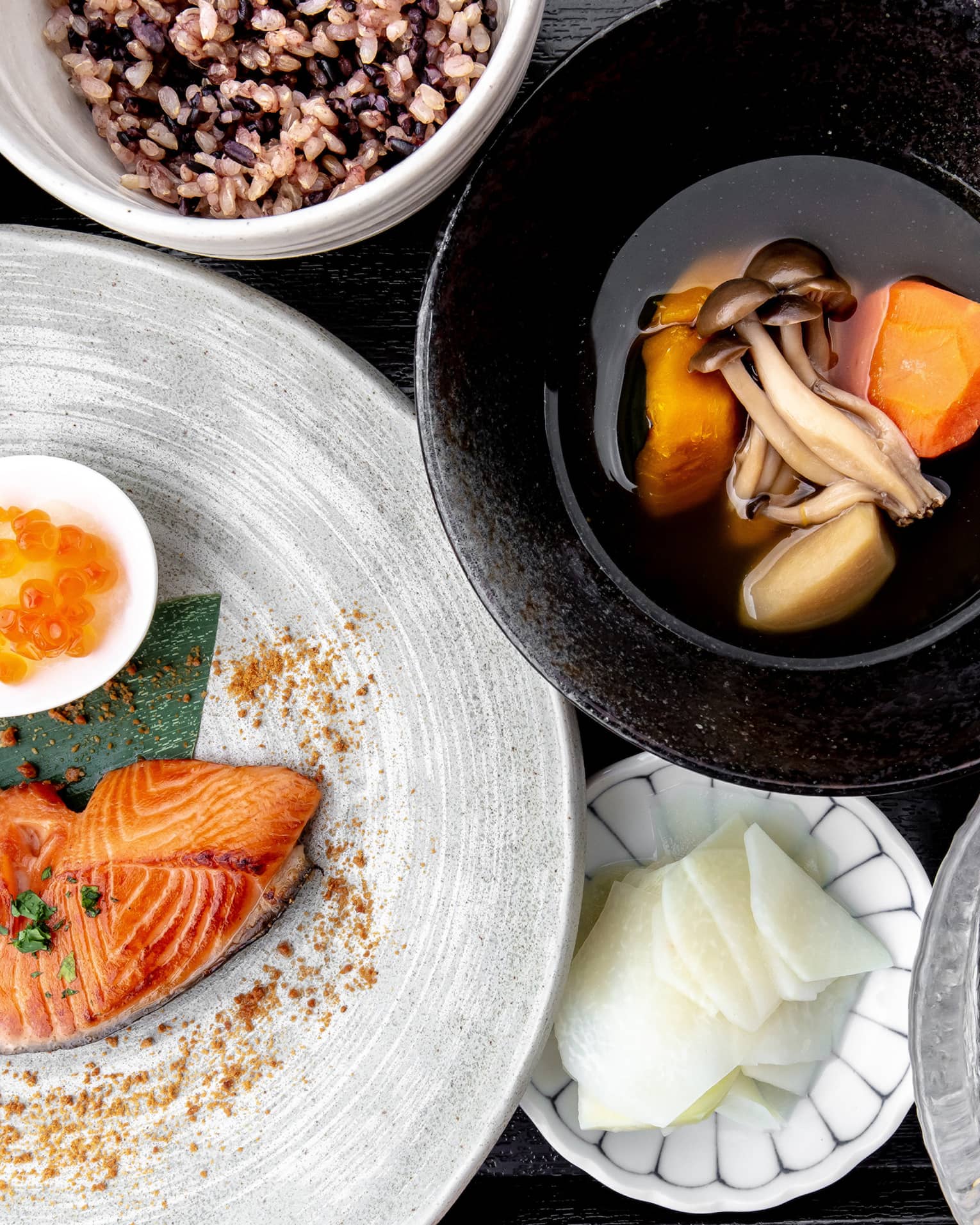 Aerial view of traditional Nourish spread, including salmon, sweet potato and mushroom soup