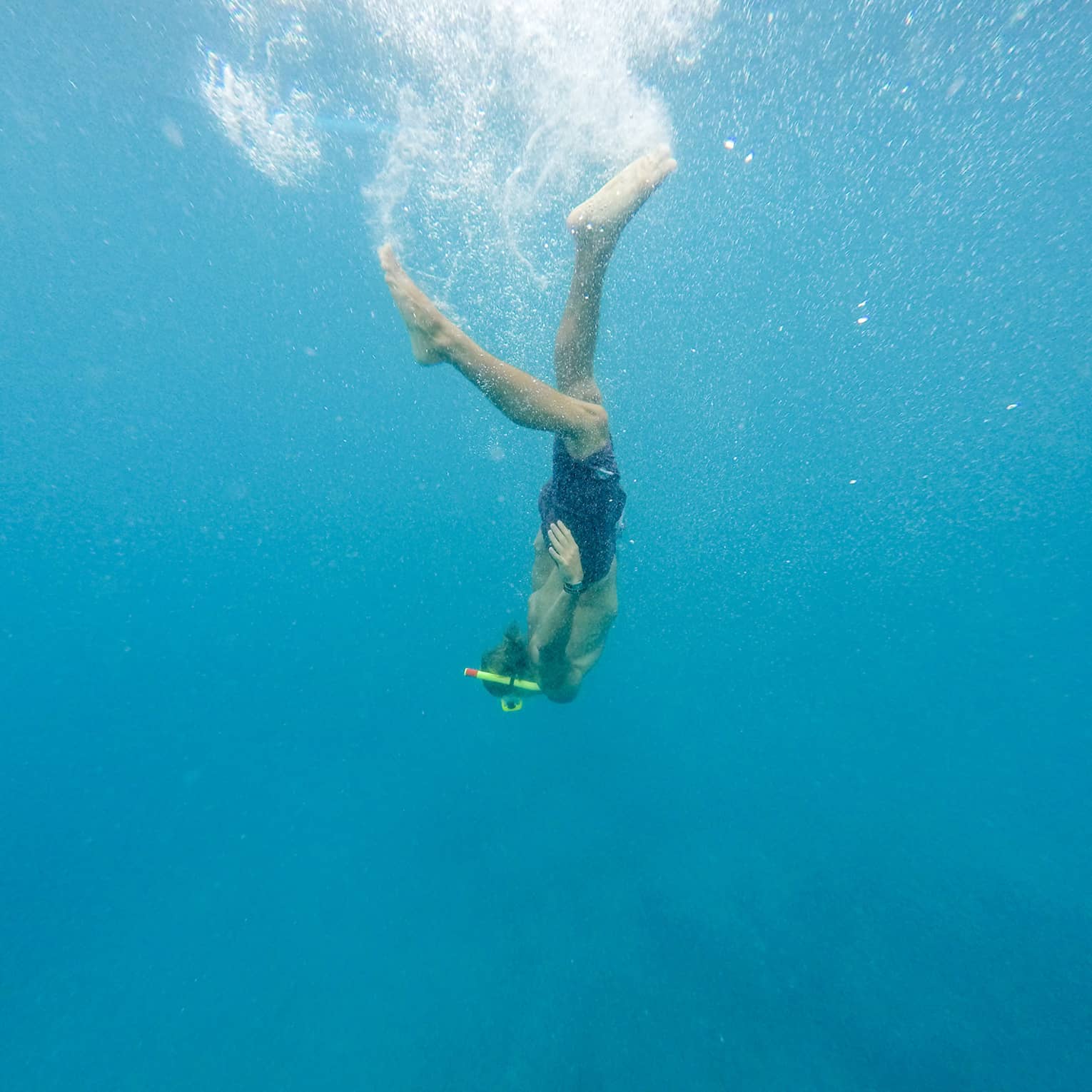 Woman diving underwater in ocean