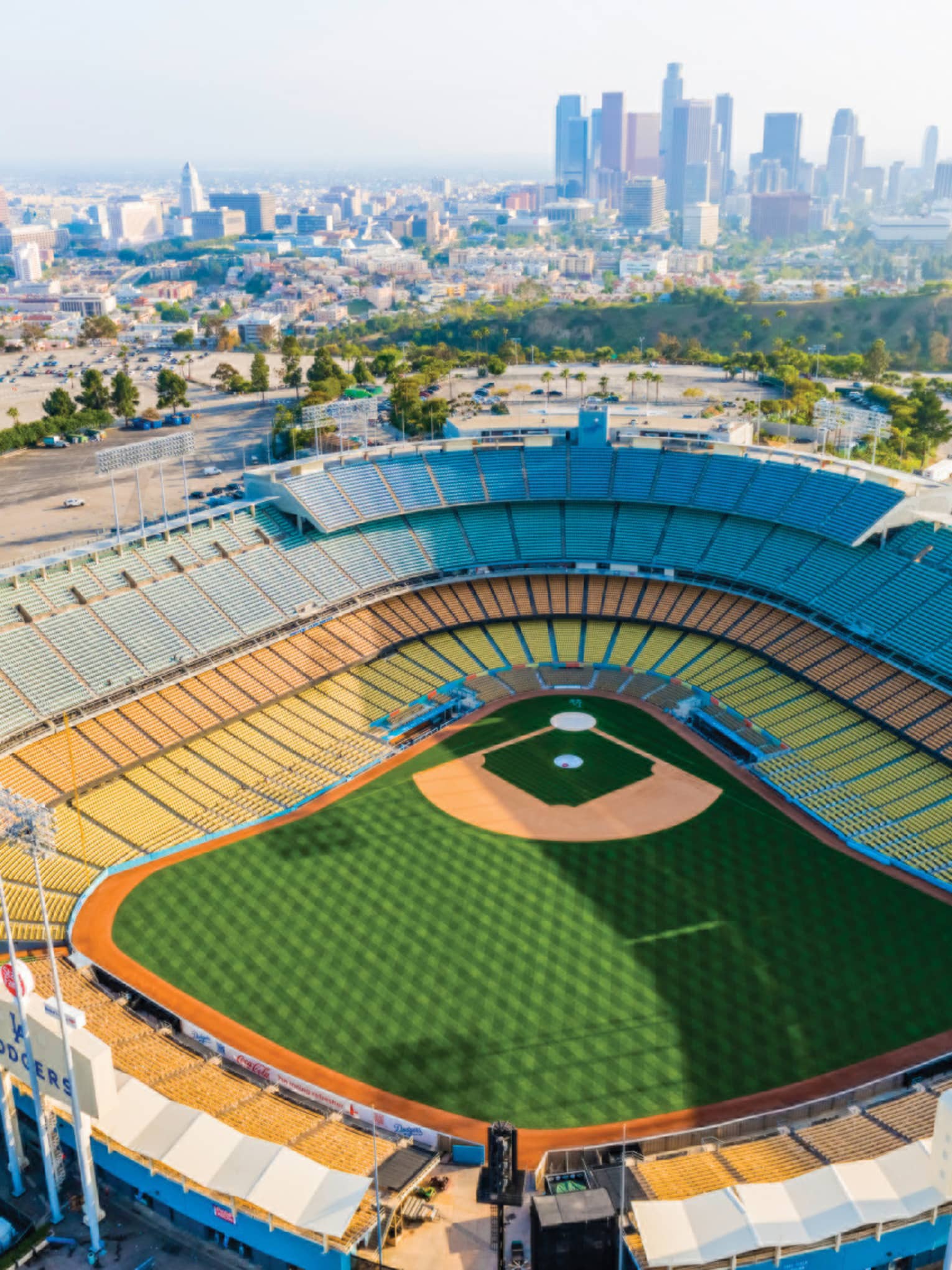Football stadium with city buildings in the background.