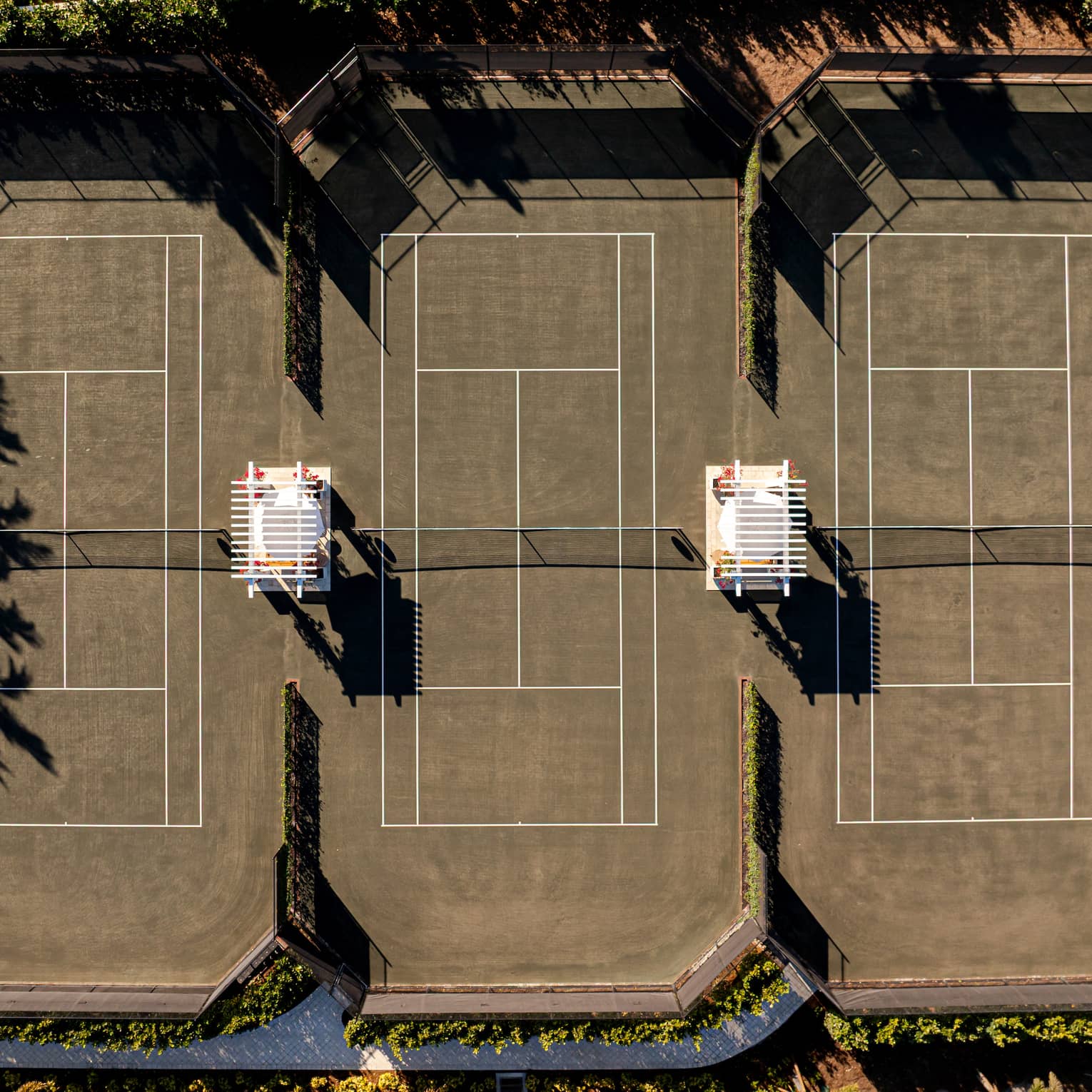 Aerial view of three outdoor tennis courts