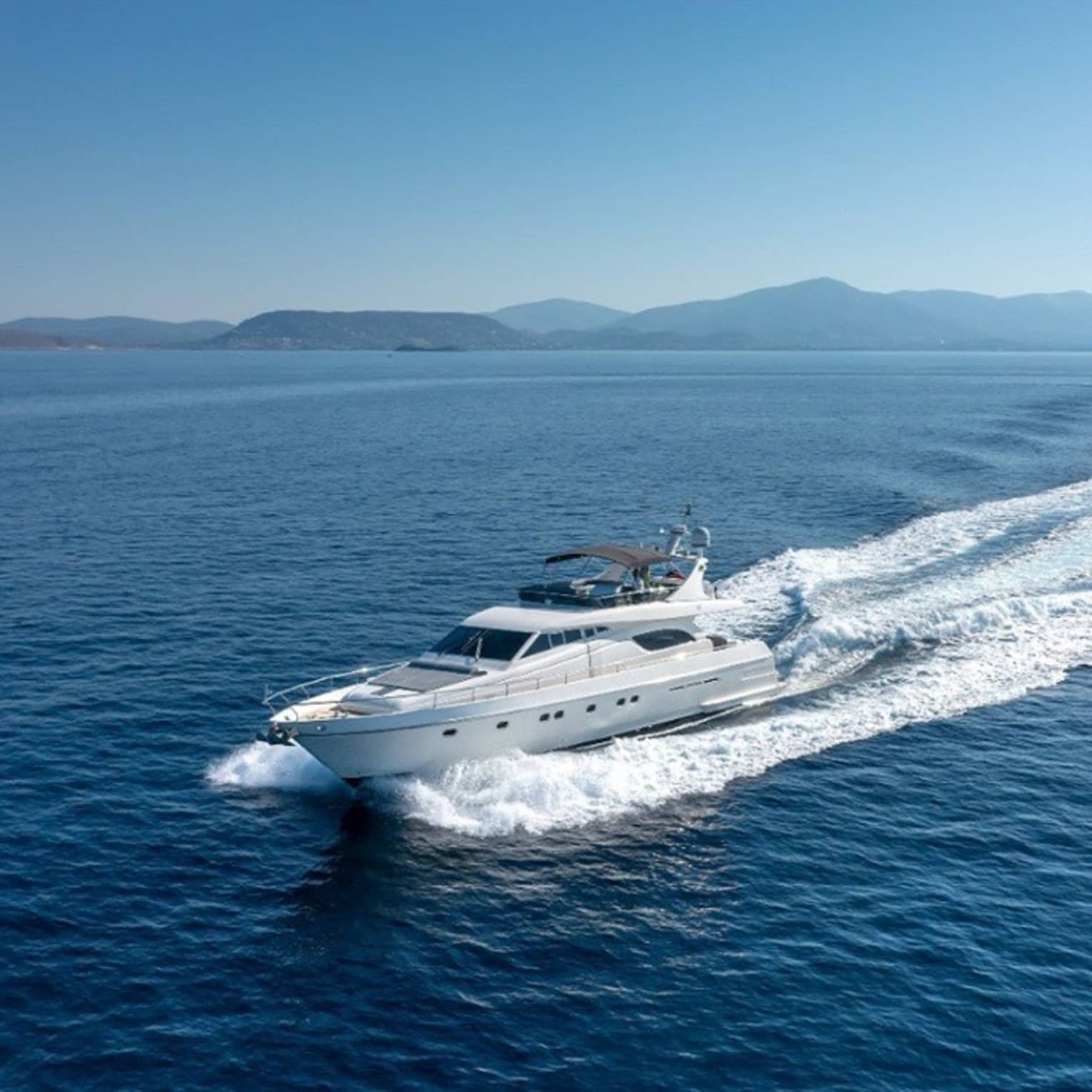 Yacht cruising crystal-blue waters