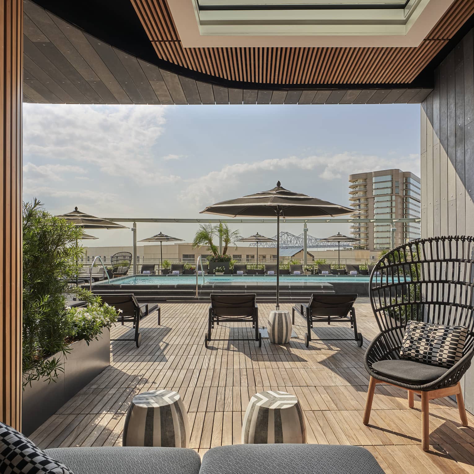 A cabana near an outdoor pool.