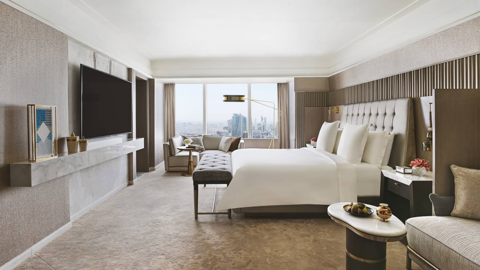 Bedroom with king bed, TV and sitting area