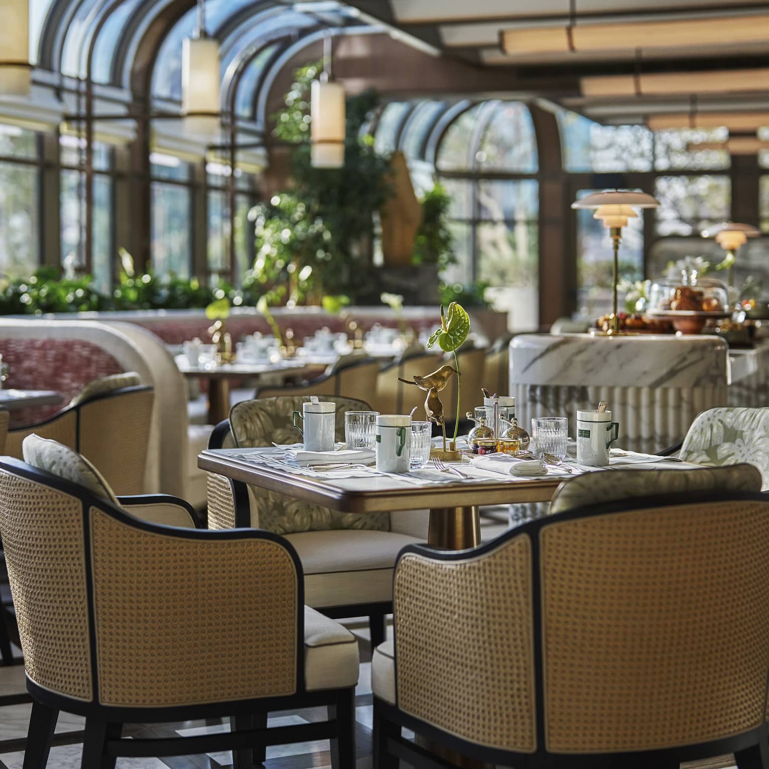Dining table set in a glass-ceiling dining terrace