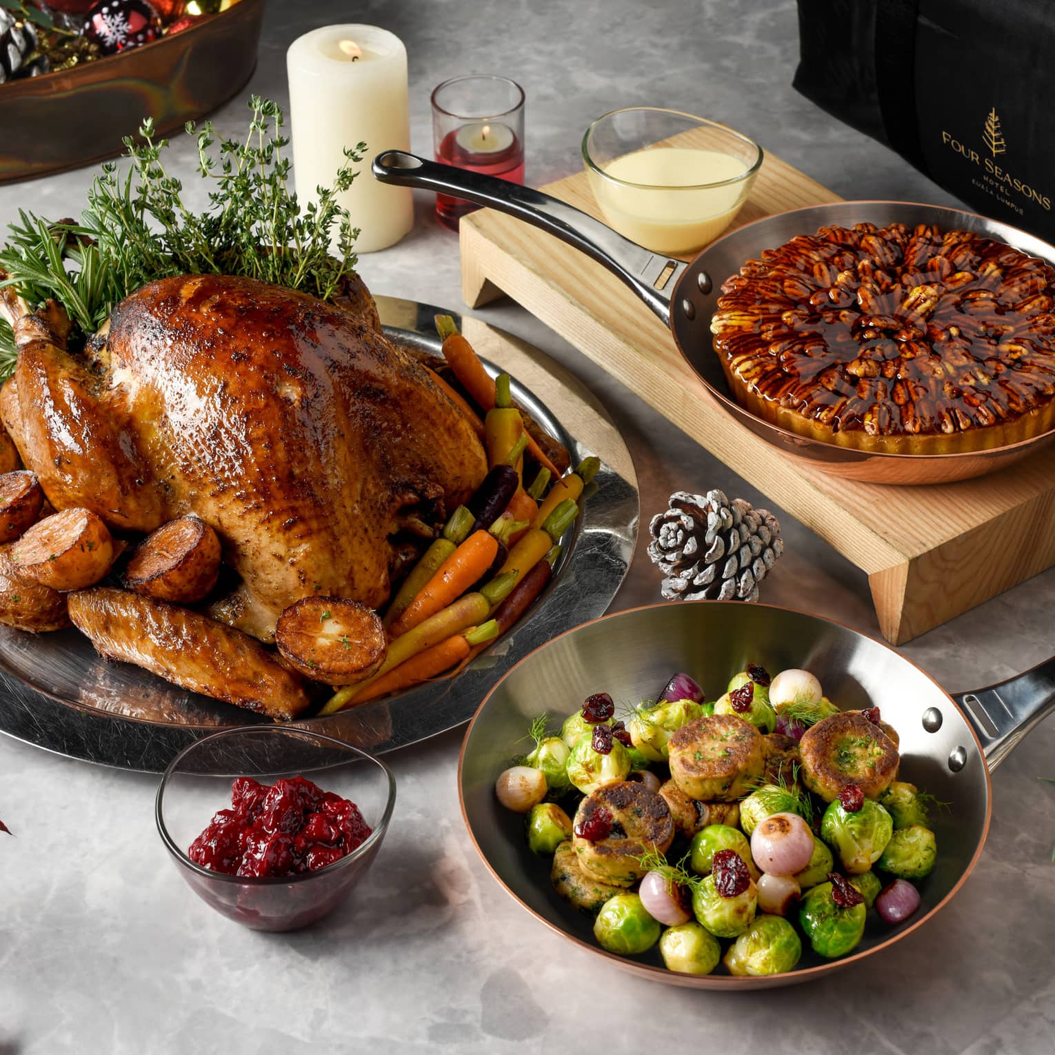 Holiday feast with whole turkey, roasted Brussels sprouts and pearl onions, and glazed pecan tart