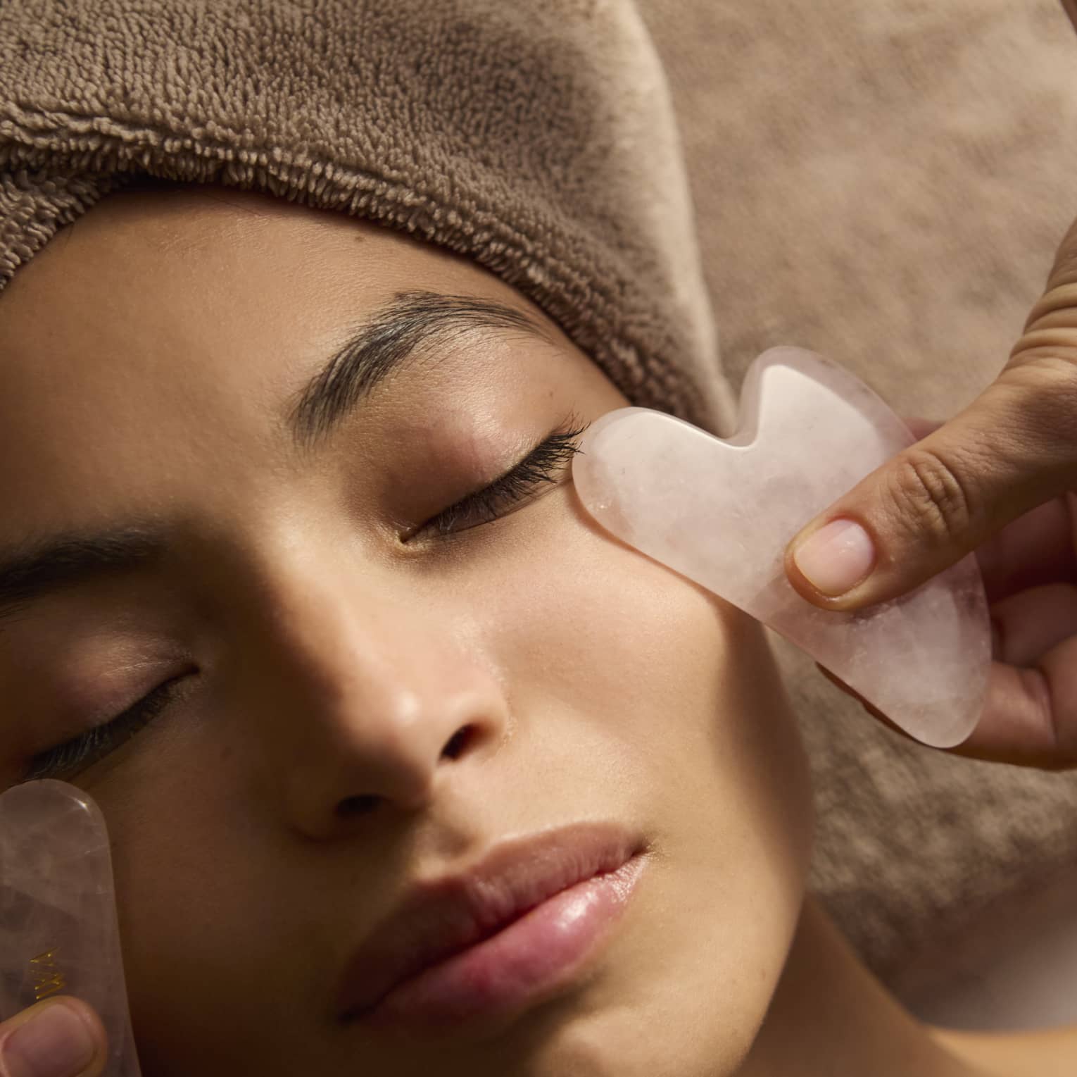 A person receives a facial treatment.