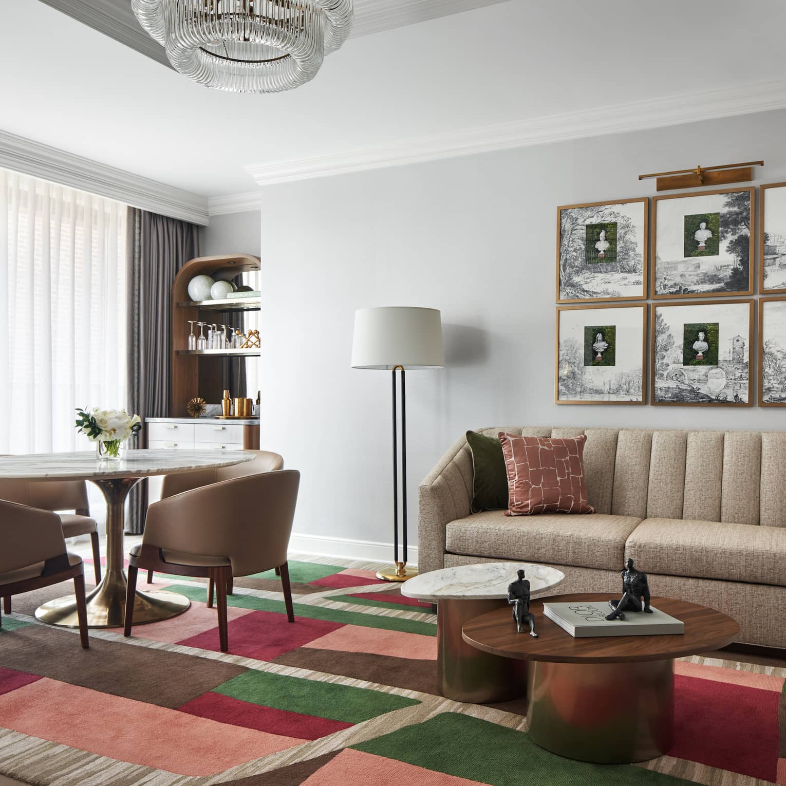 Capital Suite living room with sofa and round dining table with four chairs, at Four Seasons Hotel Washington, DC