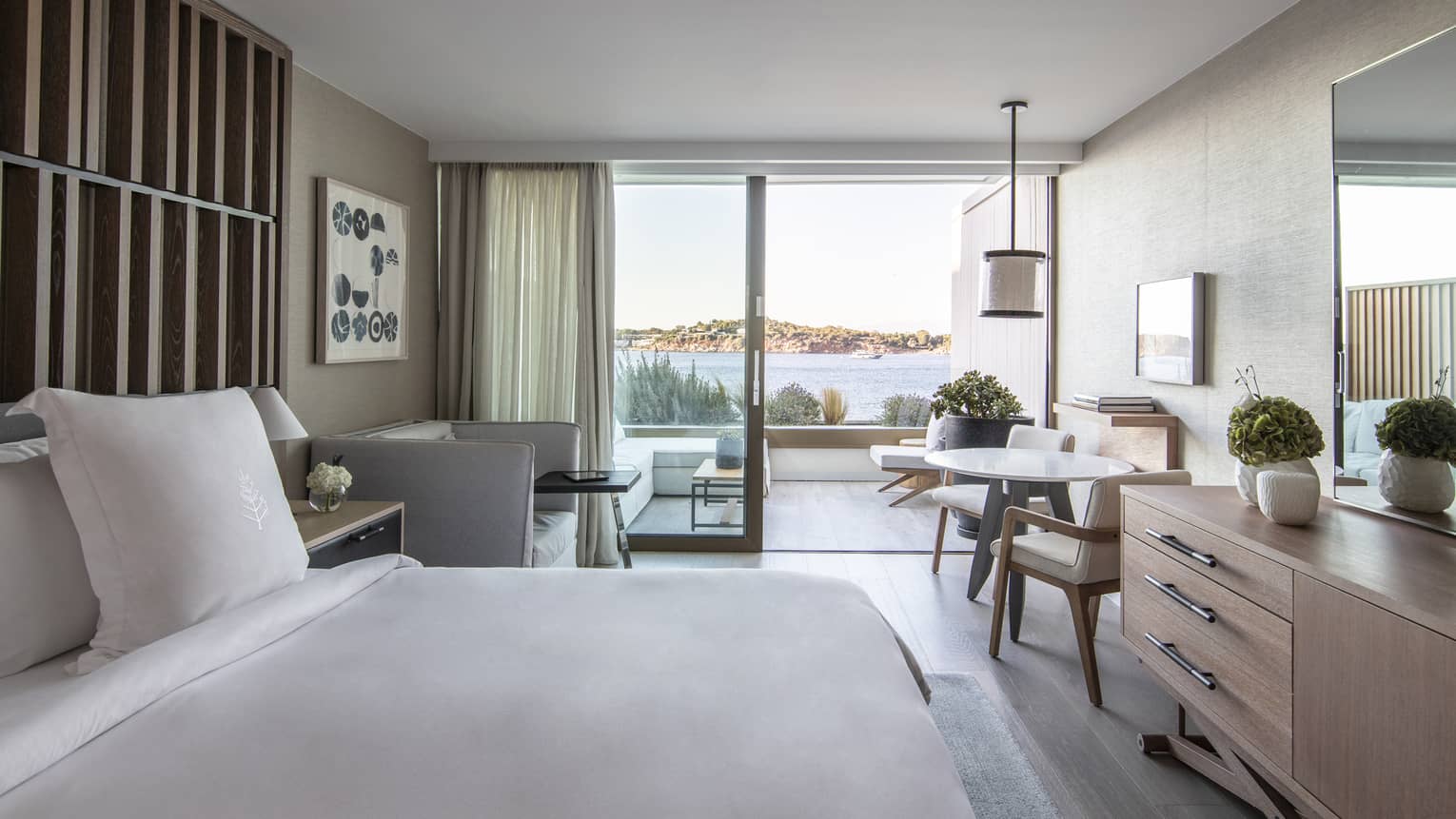 Bedroom with wooden dresser, small table and chairs, sofa, walk-out terrace,Bedroom with wooden dresser, small table and chairs, sofa, walk-out terrace