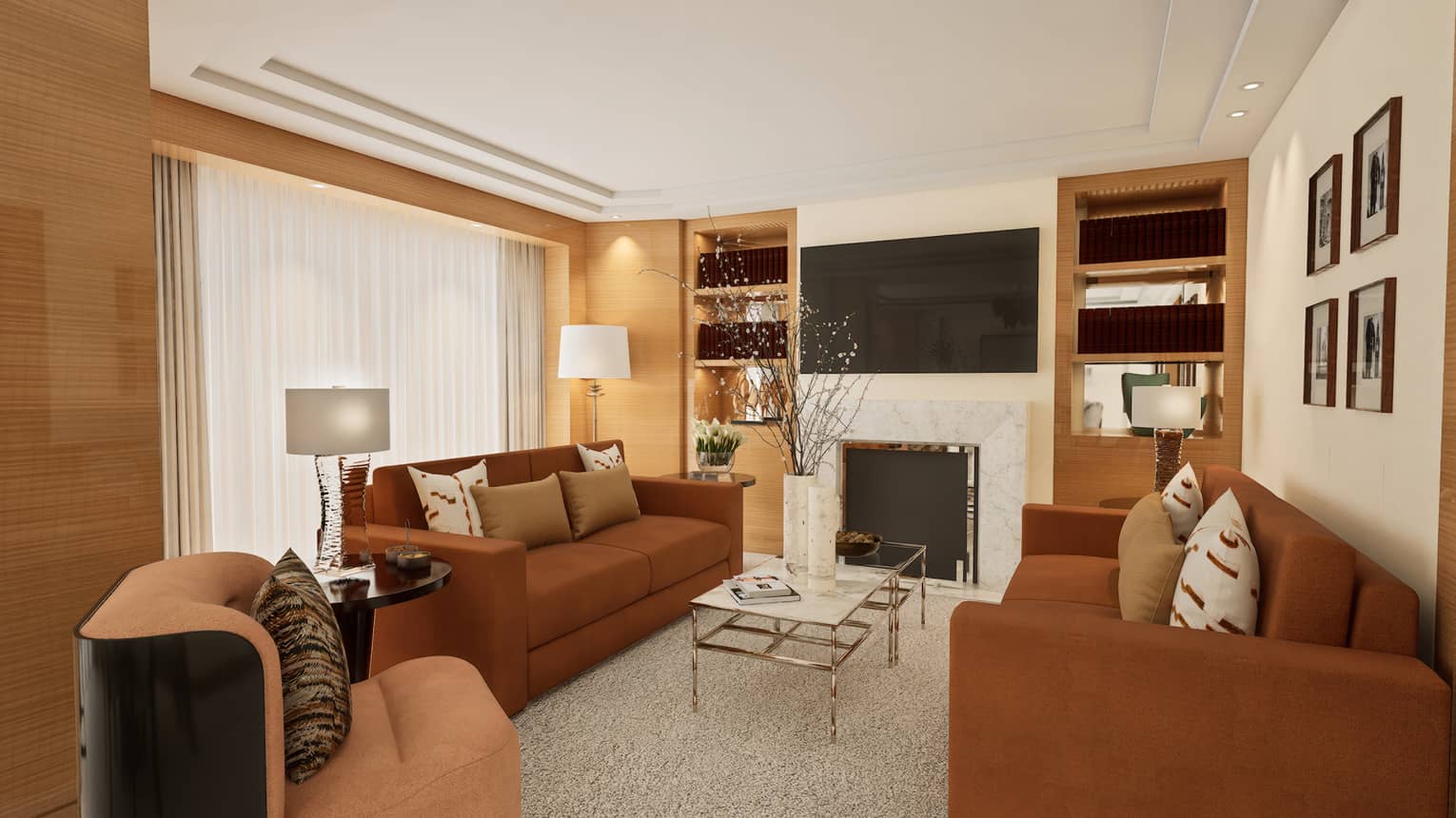 Hotel suite living room with two brown sofas facing coffee table, plus a media centre
