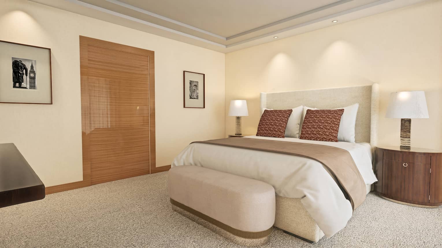 Hotel room featuring king bed, cushioned bench and bedside tables and lamps