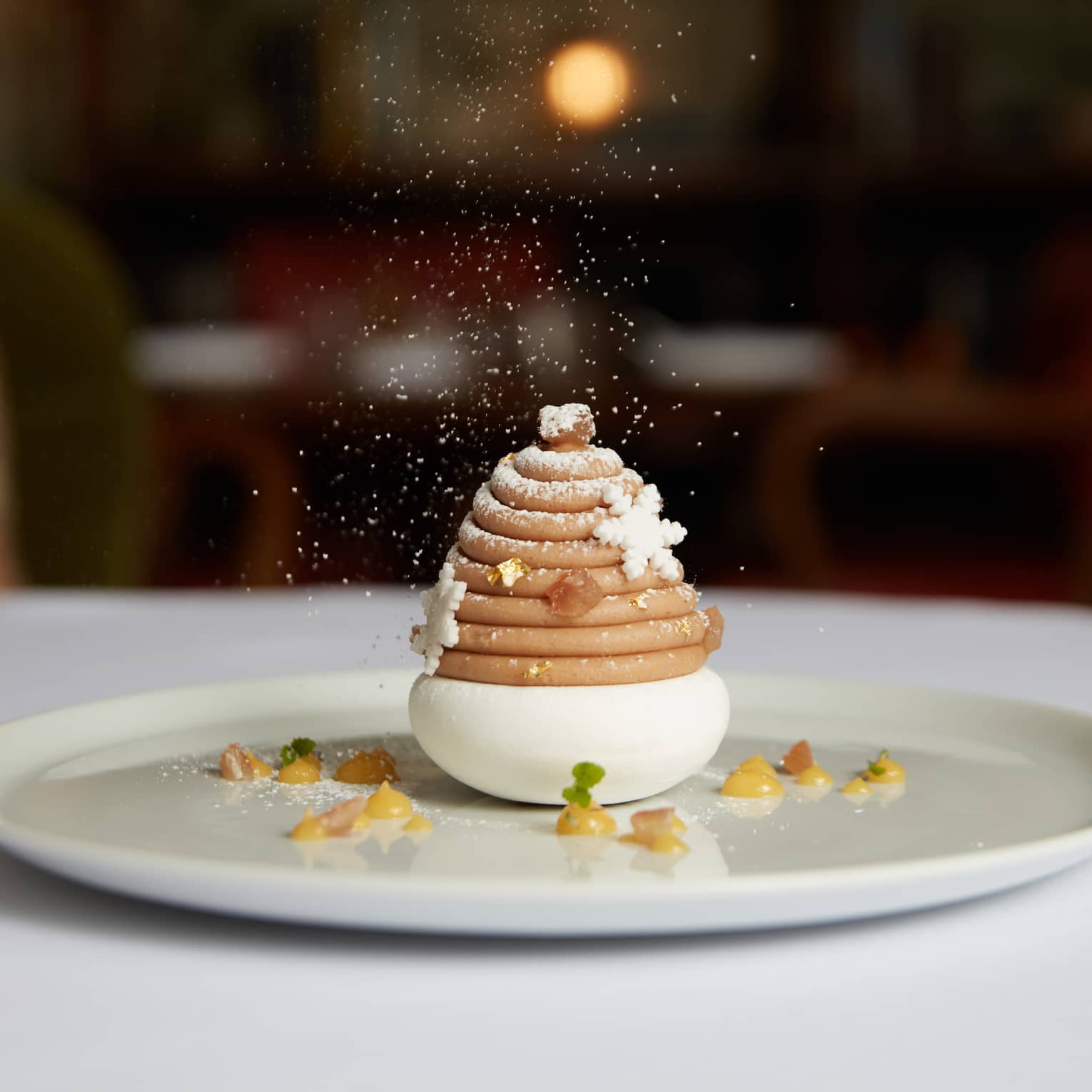 A dessert shaped like a tree on a white plate.