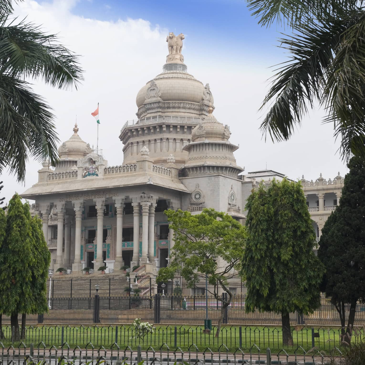 Palm trees in front of Vidhana Soudha government building exterior