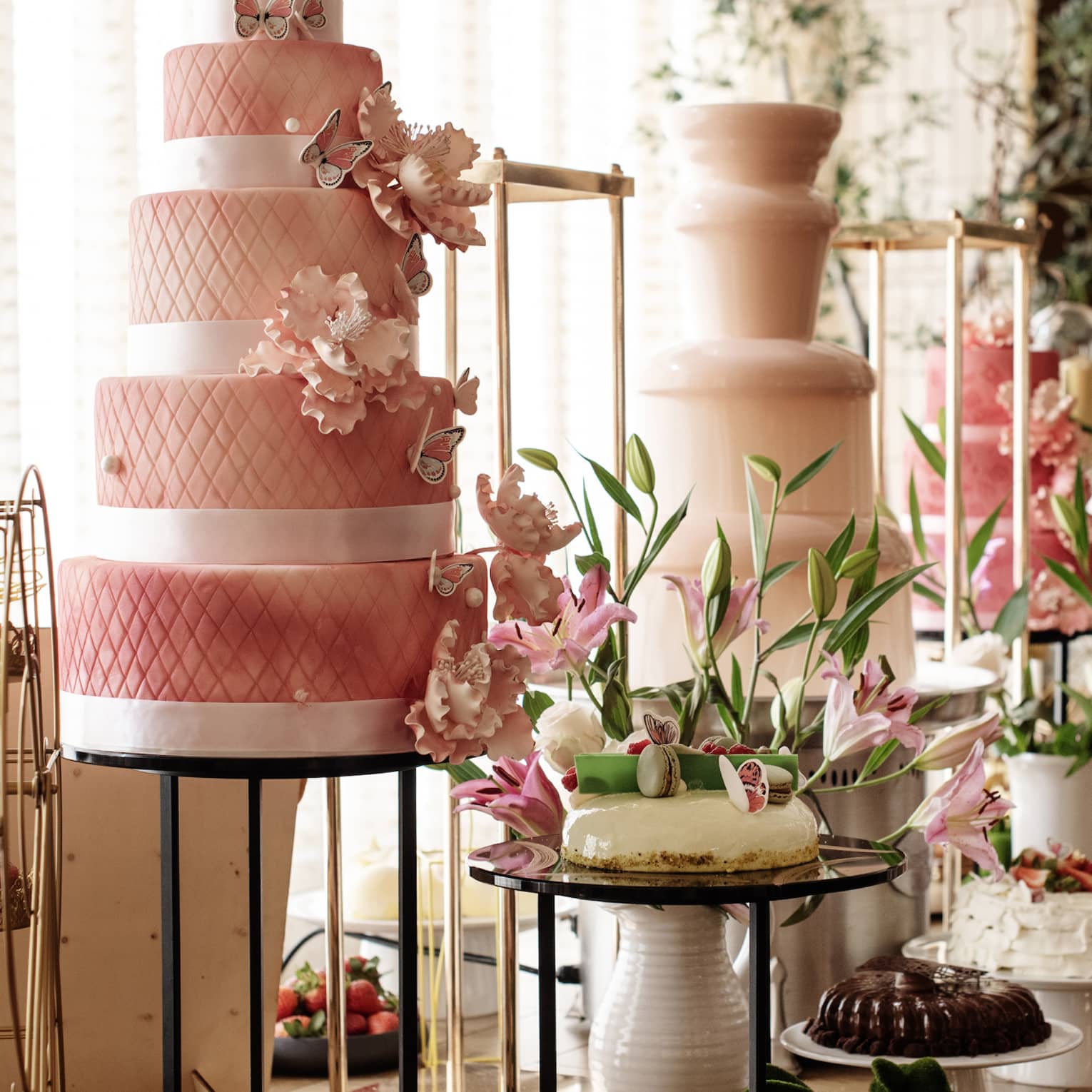 A buffet with cakes, cupcakes and desserts