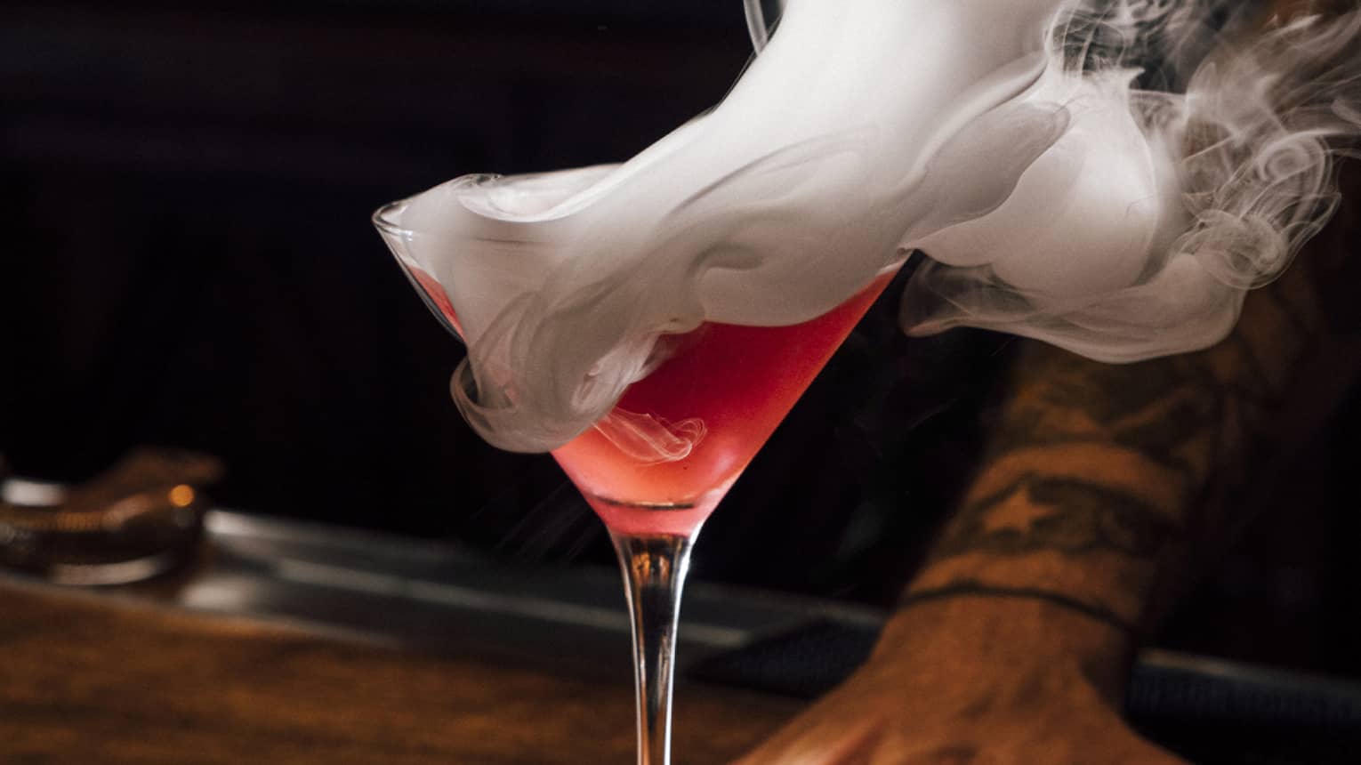 Red martini cocktail with smoke