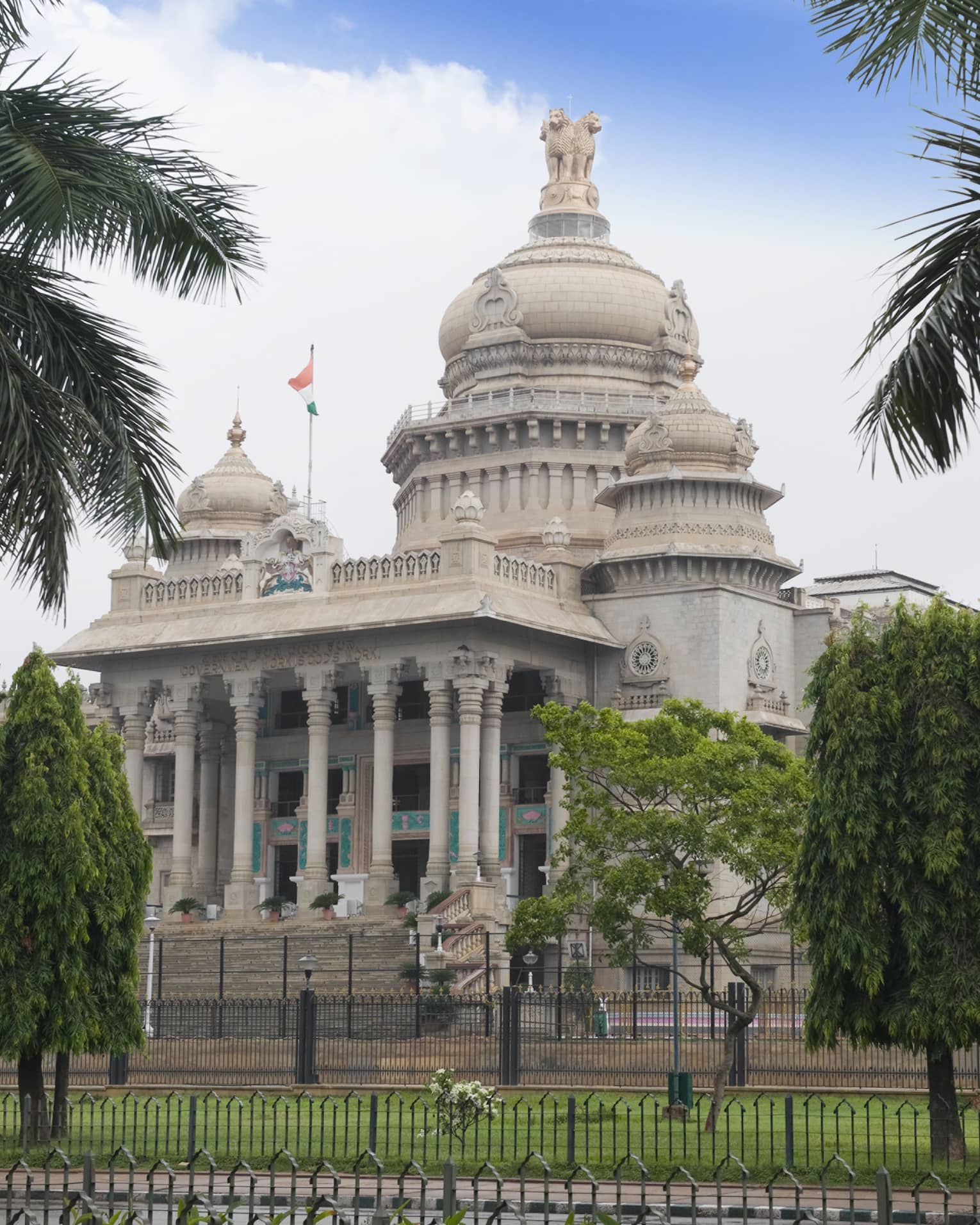 Palm trees in front of Vidhana Soudha government building exterior
