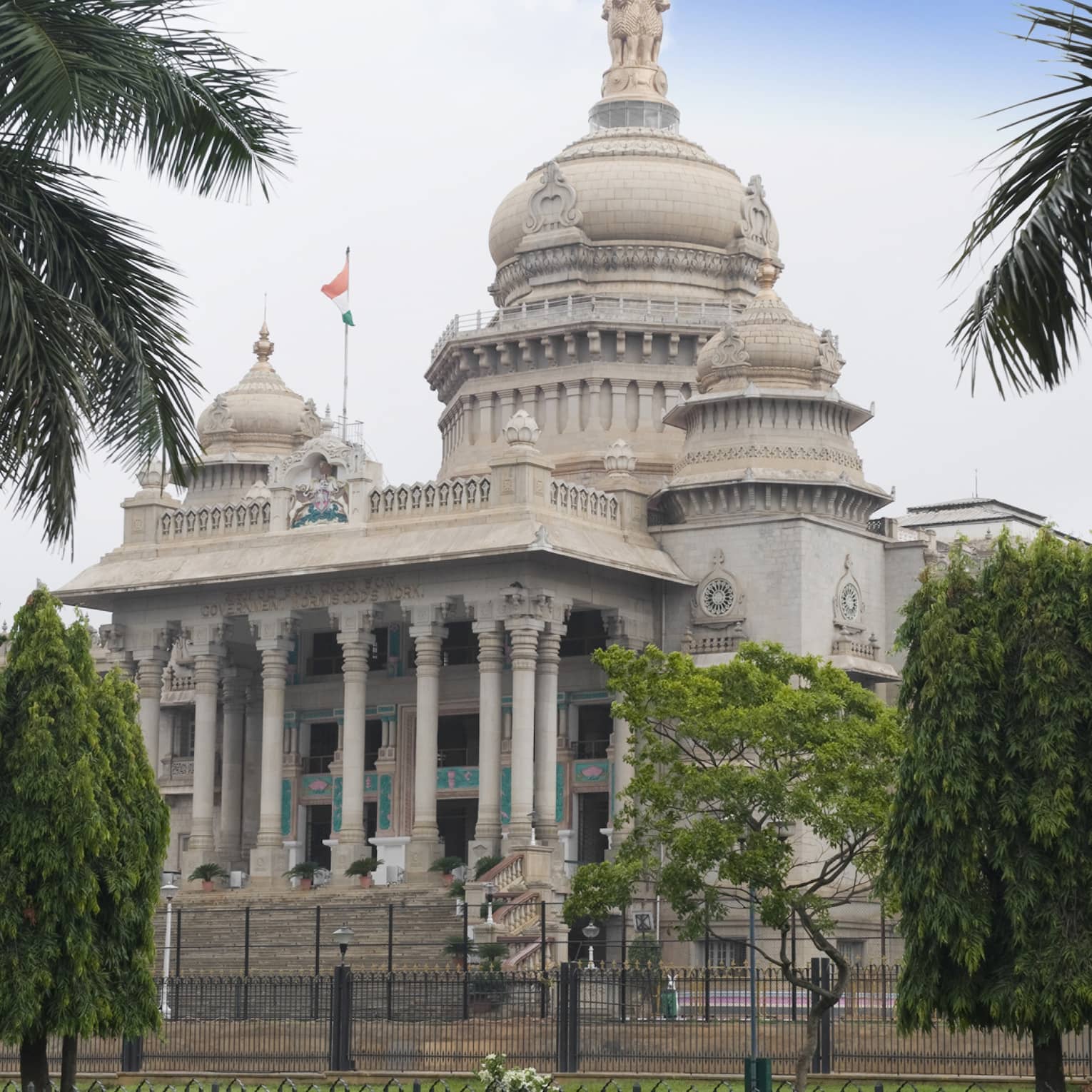 Palm trees in front of Vidhana Soudha government building exterior