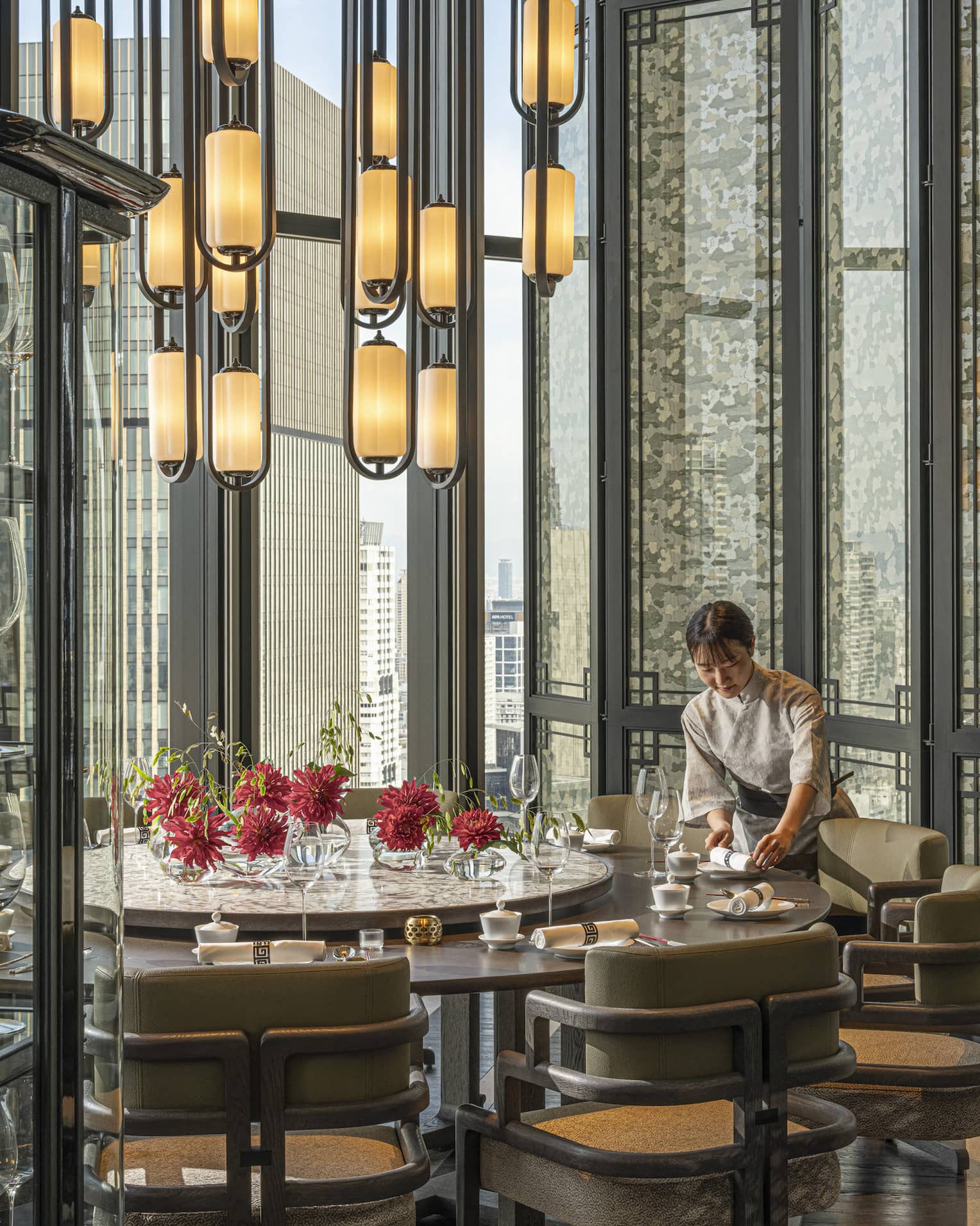 Light-filled dining area inside Jiang Nan Chun restaurant at Four Seasons Hotel Osaka