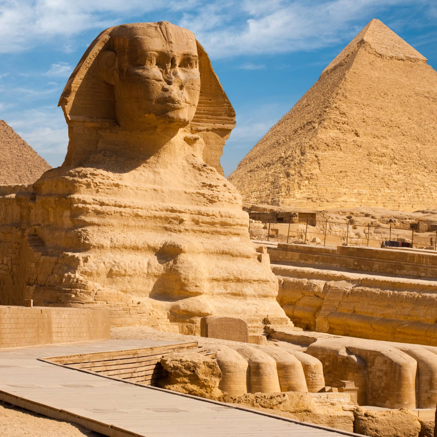 The Great Sphinx including the pyramids in the background