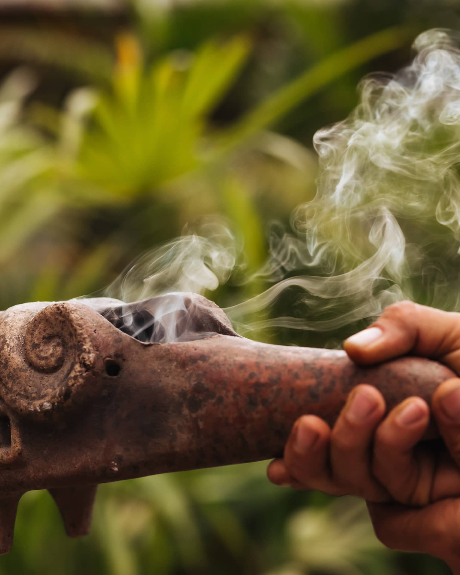Smoke emerges from traditional Mayan copal pipe