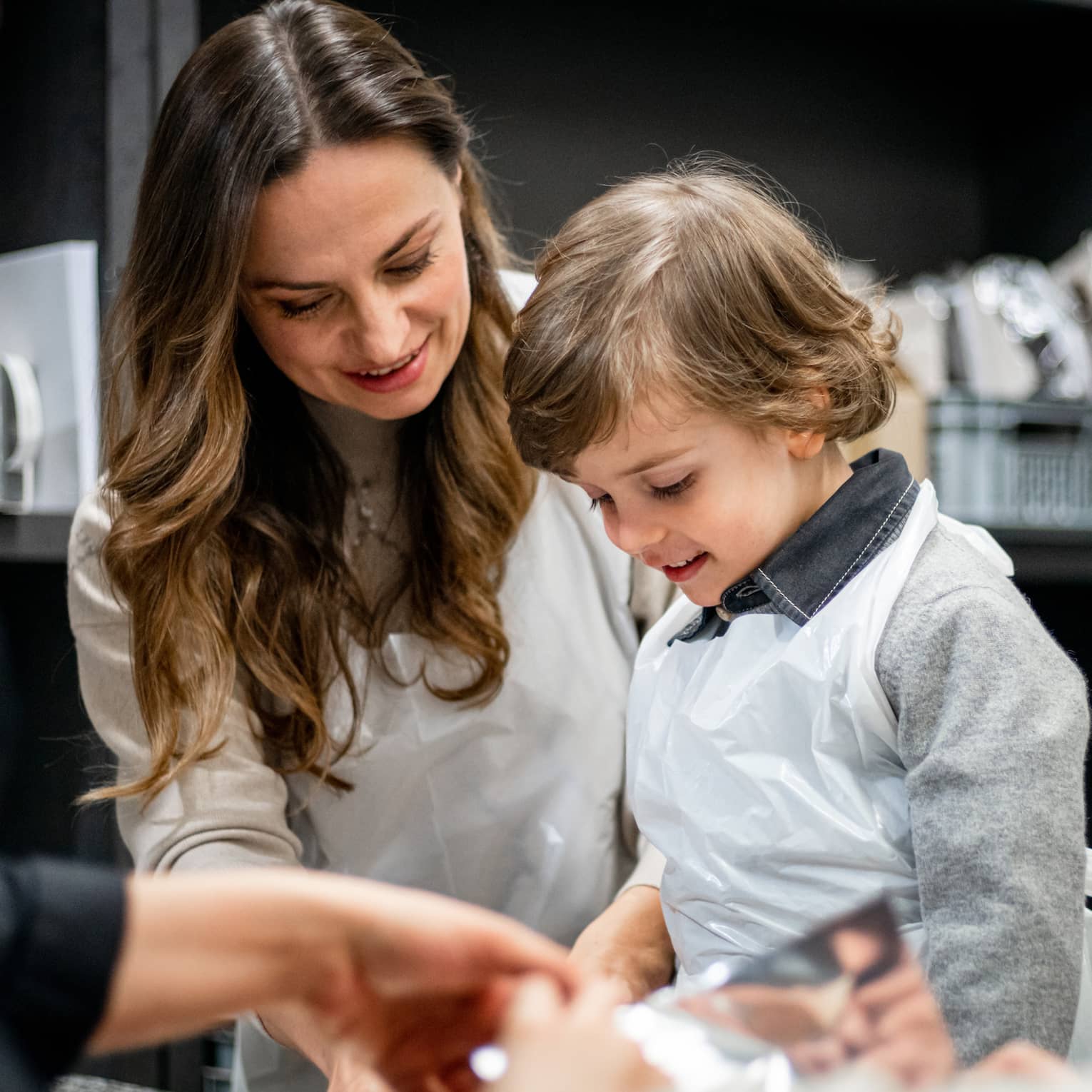A family doing an activity in a kitchen.