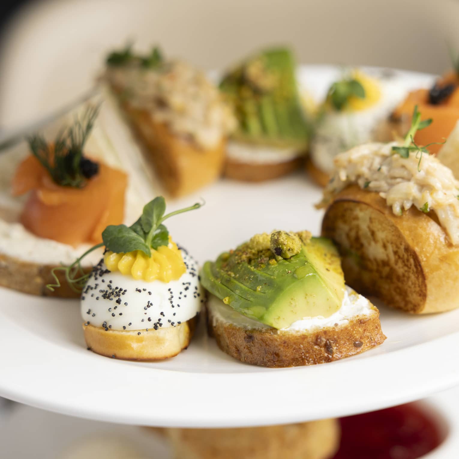 A plate full of various colorful hors d'oeuvres