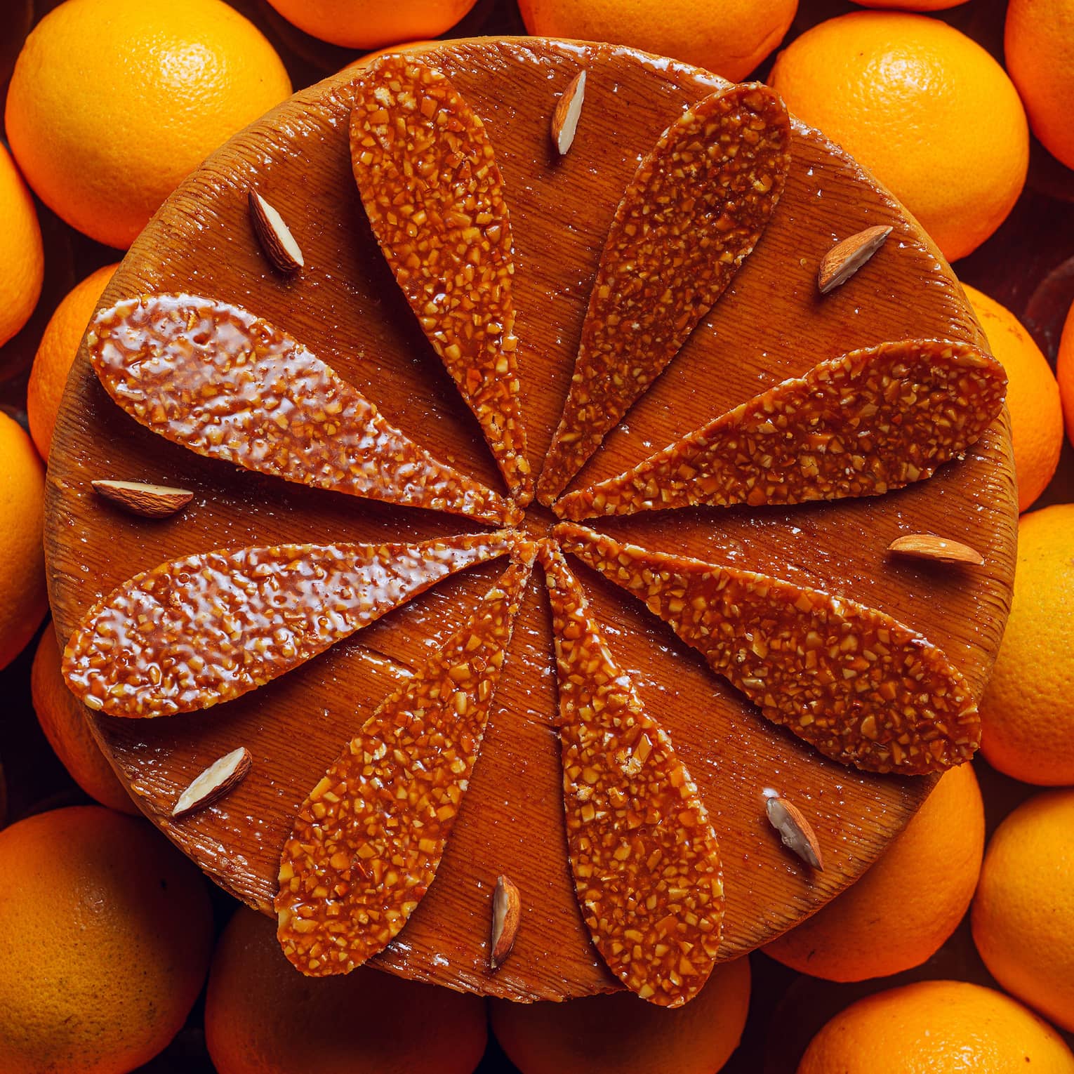 Chocolate Gallet de Rois cake surrounded by oranges