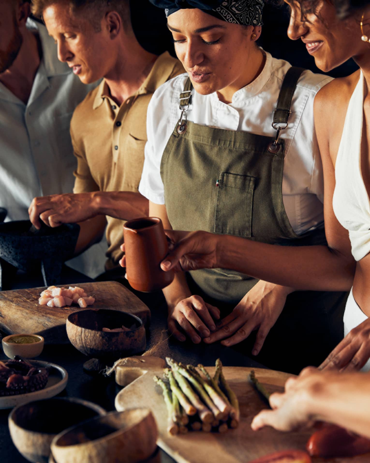 A group of people cooking food.