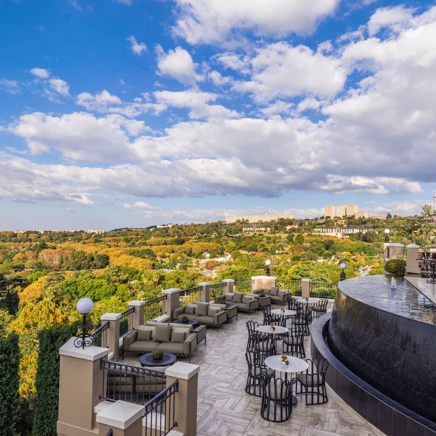 Curved View Restaurant patio overlooking green trees, forest