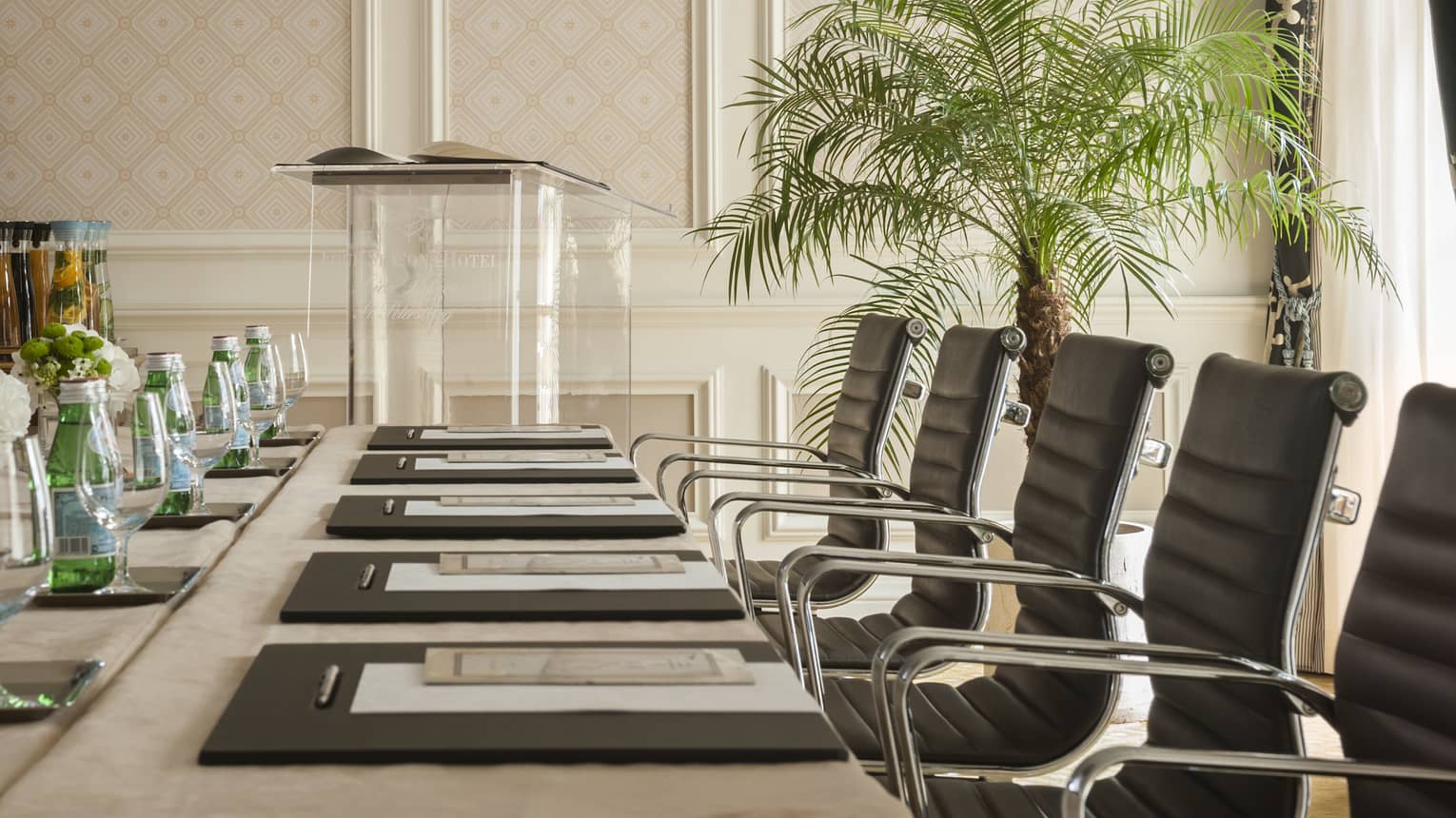 Phipps Room elegant boardroom meeting table lined with black executive chairs