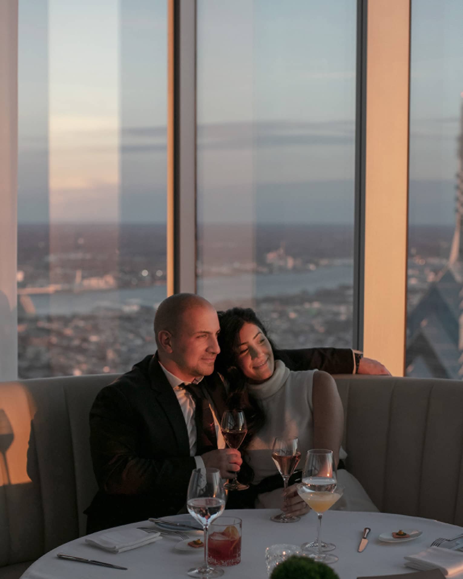 A man and woman drinking wine.