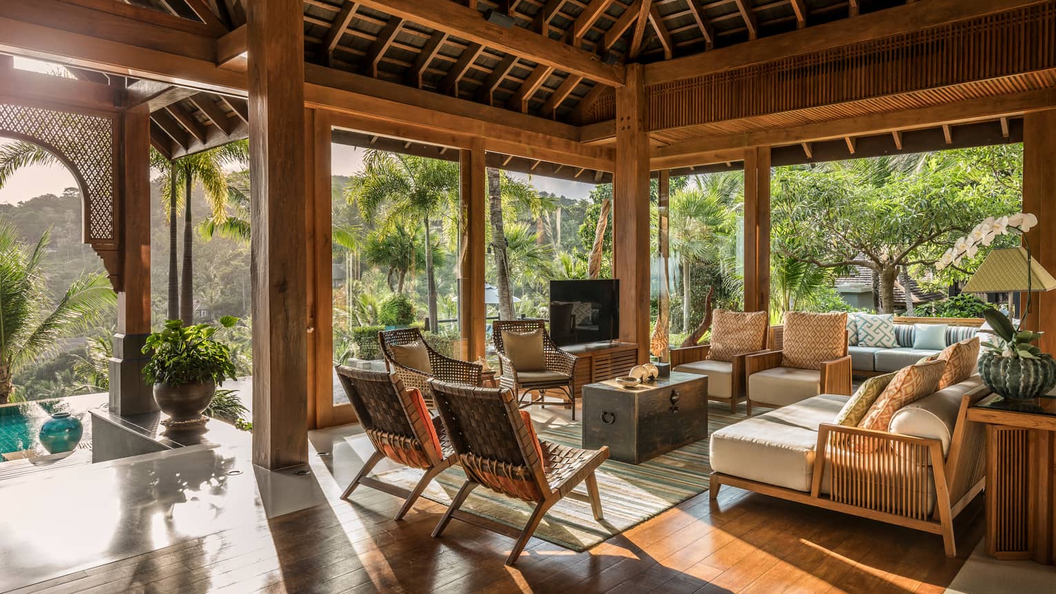 Residential terrace with seating area looking out onto the pool