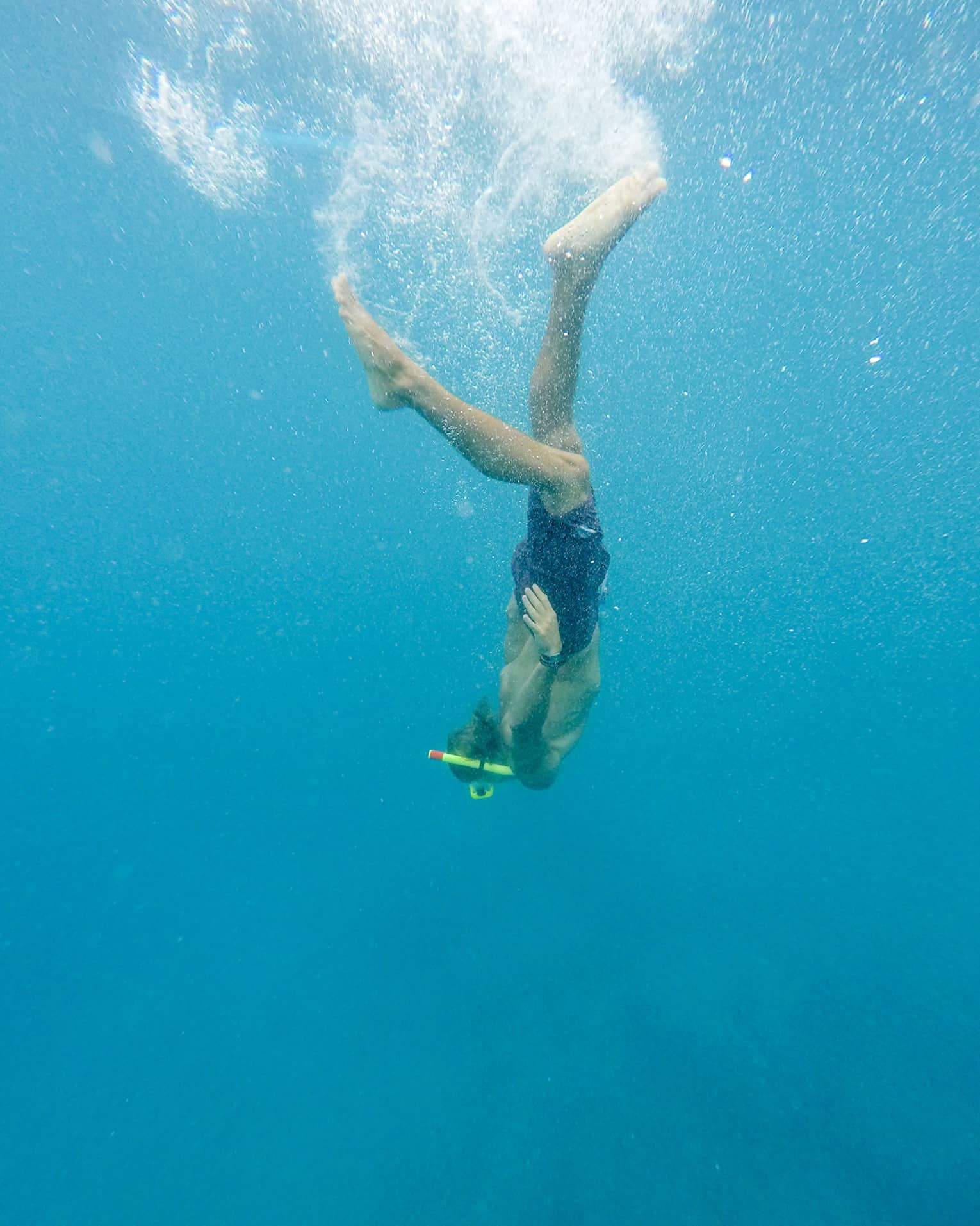 Woman diving underwater in ocean