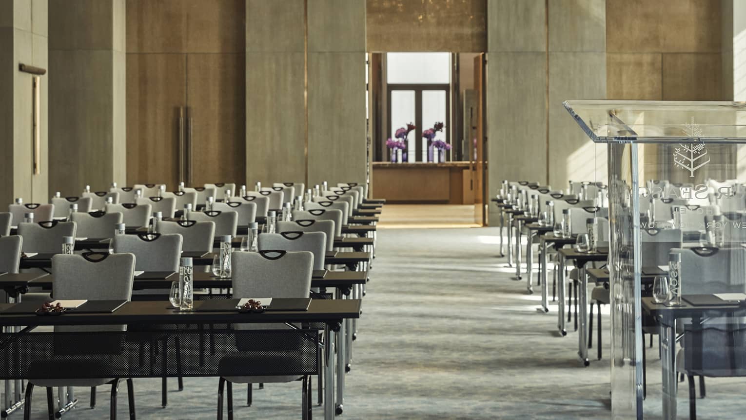 Greenwich Ballroom event space view from glass podium over rows of meeting tables, chairs