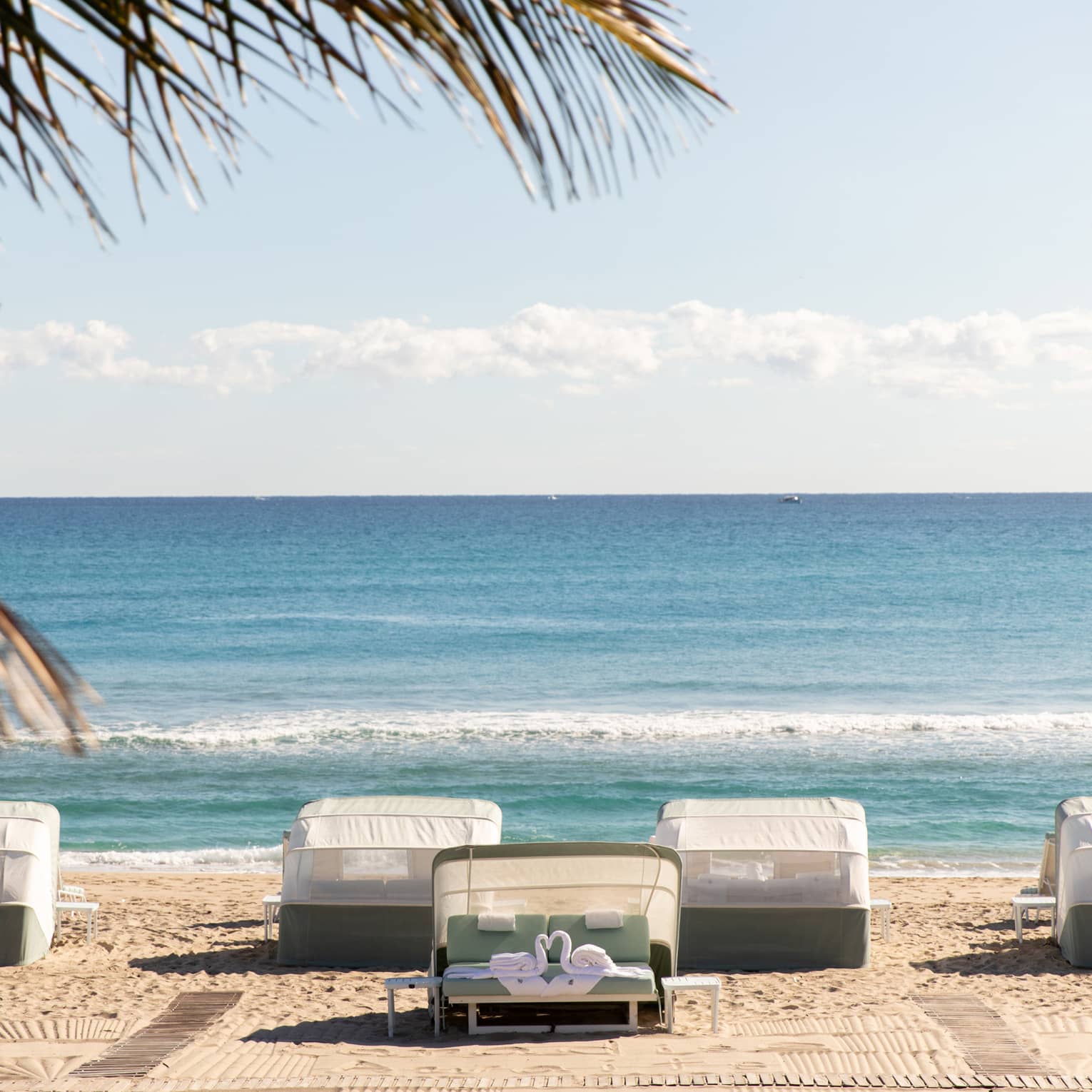 Five beachfront cabanas look out onto the ocean