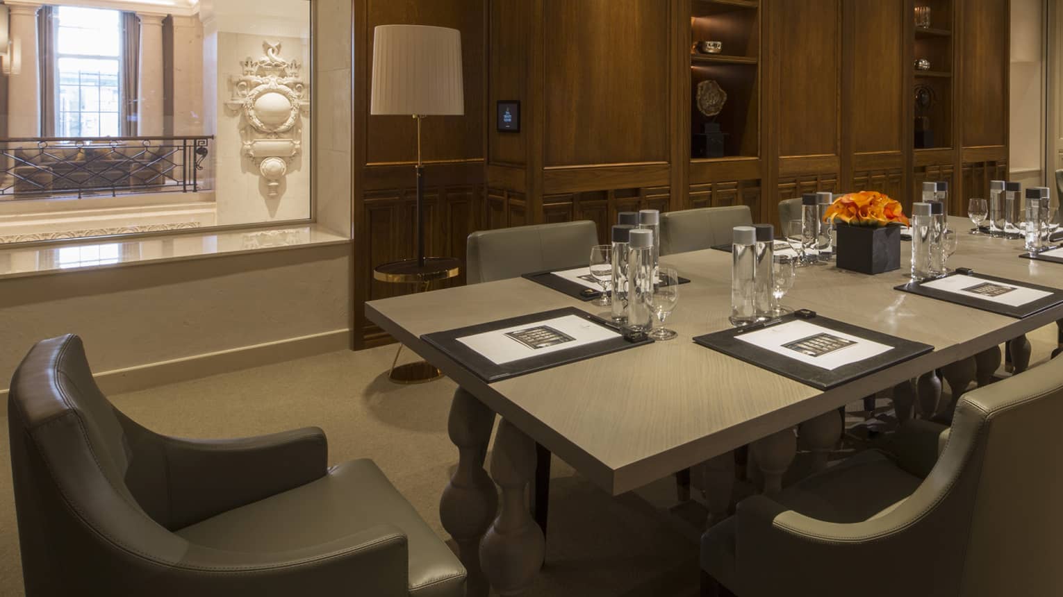 Serica Meeting Room two long boardroom tables with modern chairs, window to hall